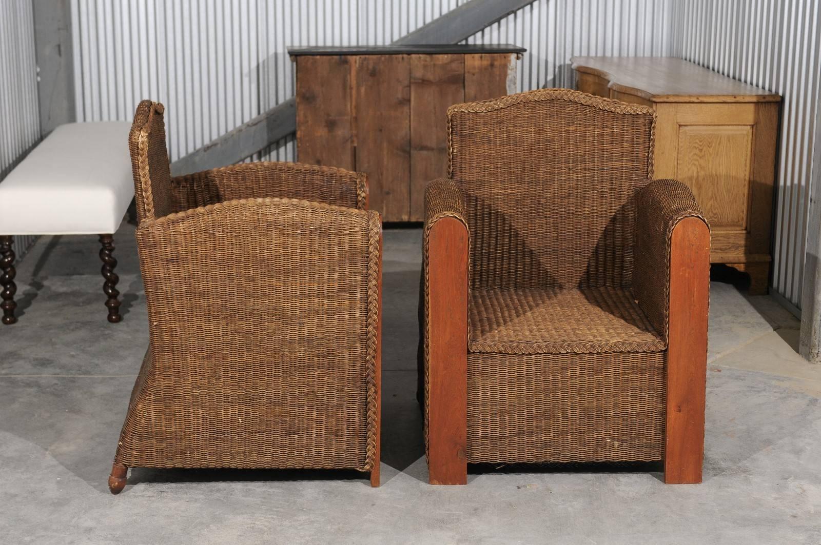 Pair of French Vintage Wicker Club Chairs with Camel Back and Tall Arms In Good Condition For Sale In Atlanta, GA