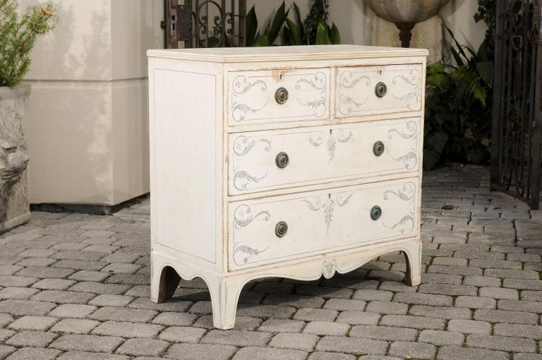 English 19th Century Off White Painted Four Drawer Chest With An English Off White Painted Four Drawer Chest With Valanced Skirt From The 19th