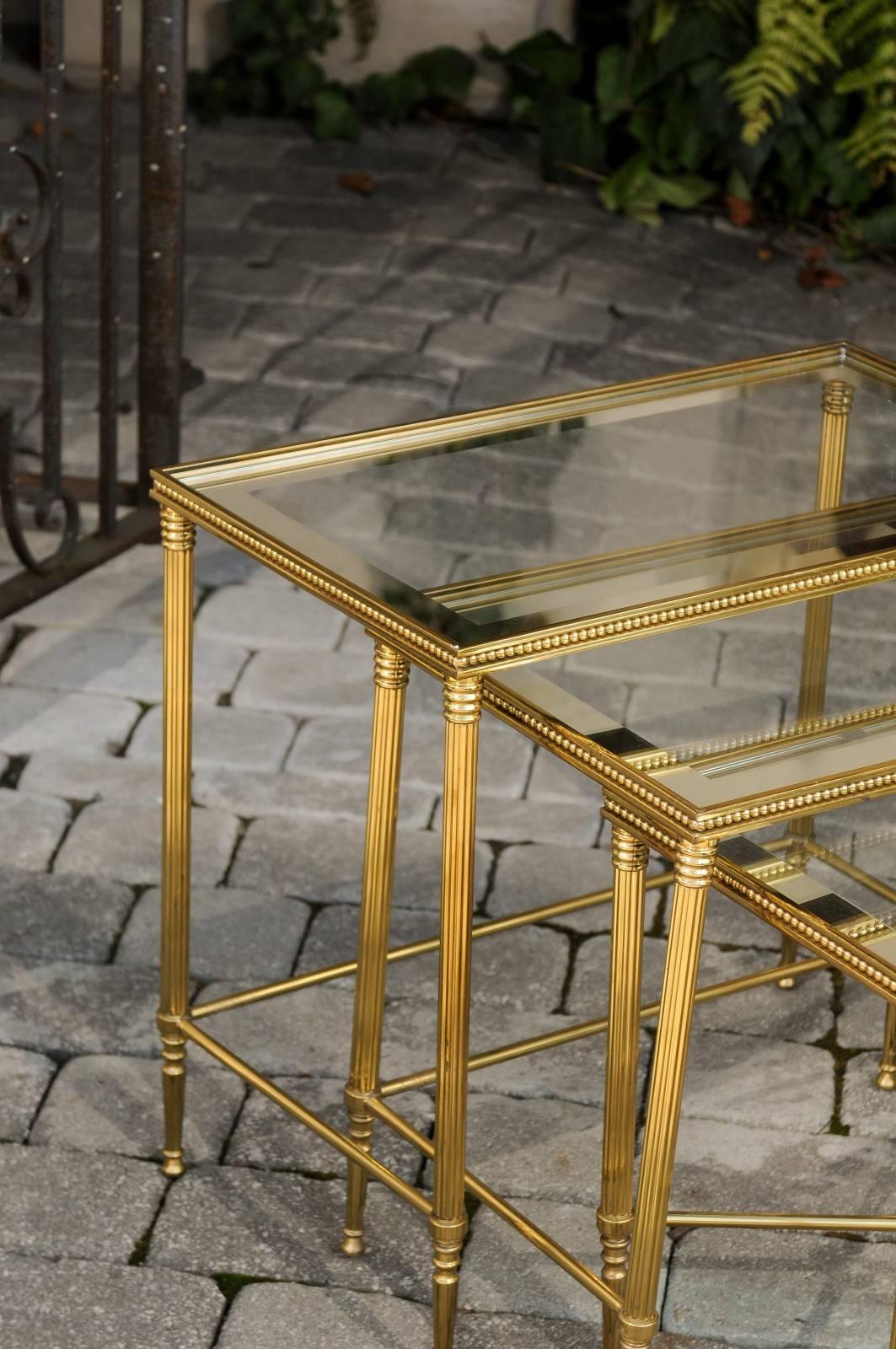 Set of Three 1950s French Brass and Glass Nesting Tables with Beaded Trim In Good Condition For Sale In Atlanta, GA