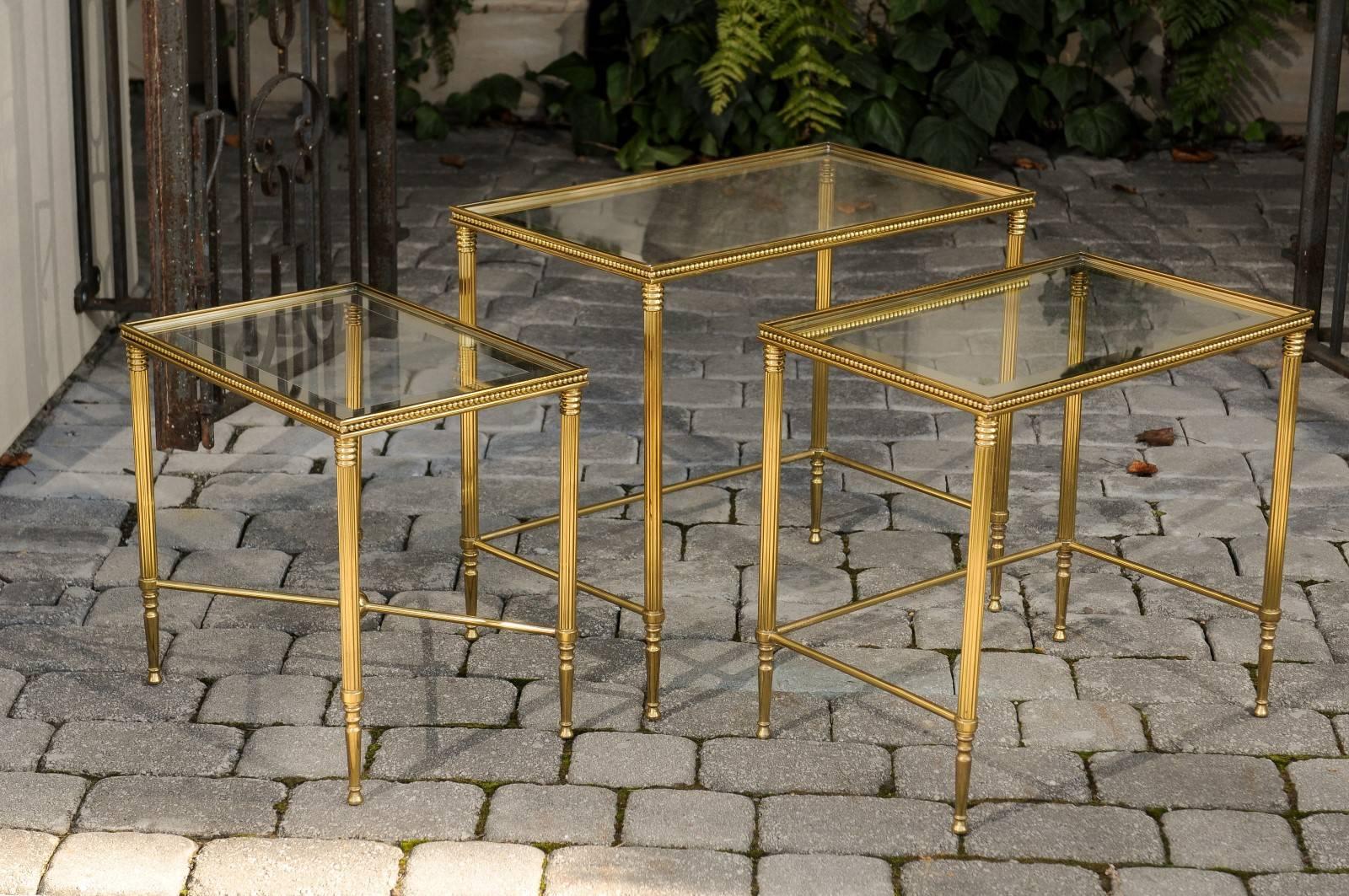 20th Century Set of Three 1950s French Brass and Glass Nesting Tables with Beaded Trim For Sale