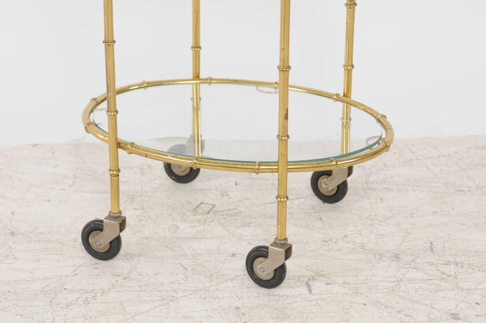 French Midcentury Brass Two-Tiered Oval Cart with Glass Shelves and Casters In Good Condition For Sale In Atlanta, GA