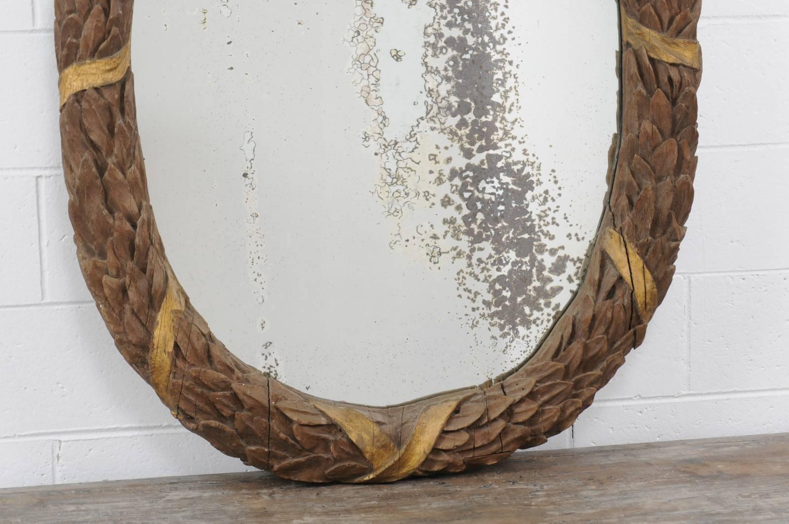 Carved Oval French Neoclassical Parcel-Gilt Ribbon-Tied Wreath Mirror, circa 1880