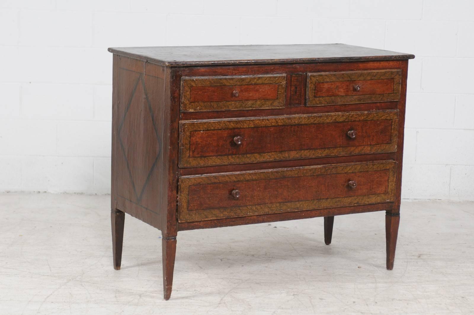 An Italian neoclassical painted wood four-drawer commode with diamond motifs on the side panels, from the early 19th century. This Italian chest features a rectangular top sitting above four drawers, two smaller ones over two larger ones. Each