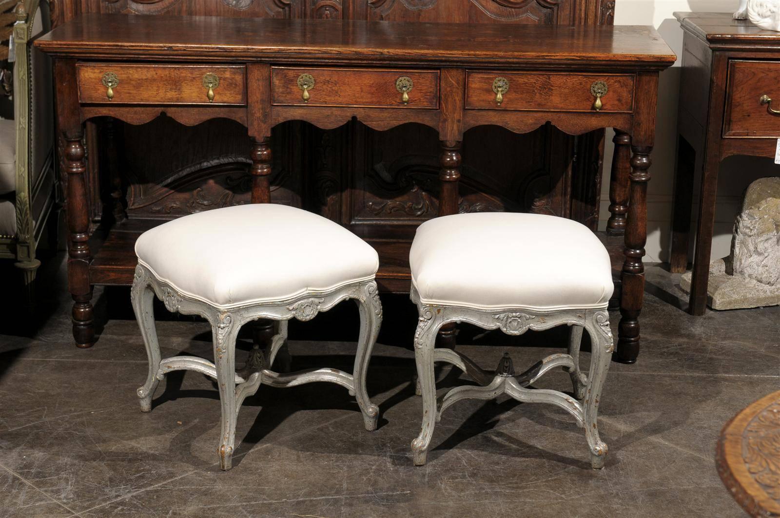 Gilt Pair of French Louis XV Style Silver Leaf Stools with Carved Cross Stretcher For Sale
