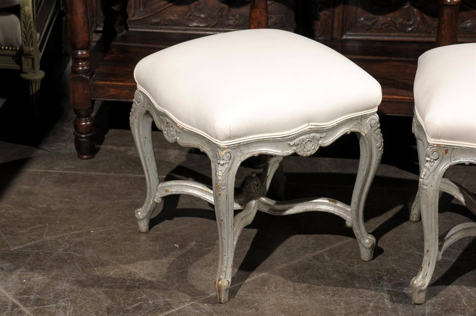 20th Century Pair of French Louis XV Style Silver Leaf Stools with Carved Cross Stretcher For Sale