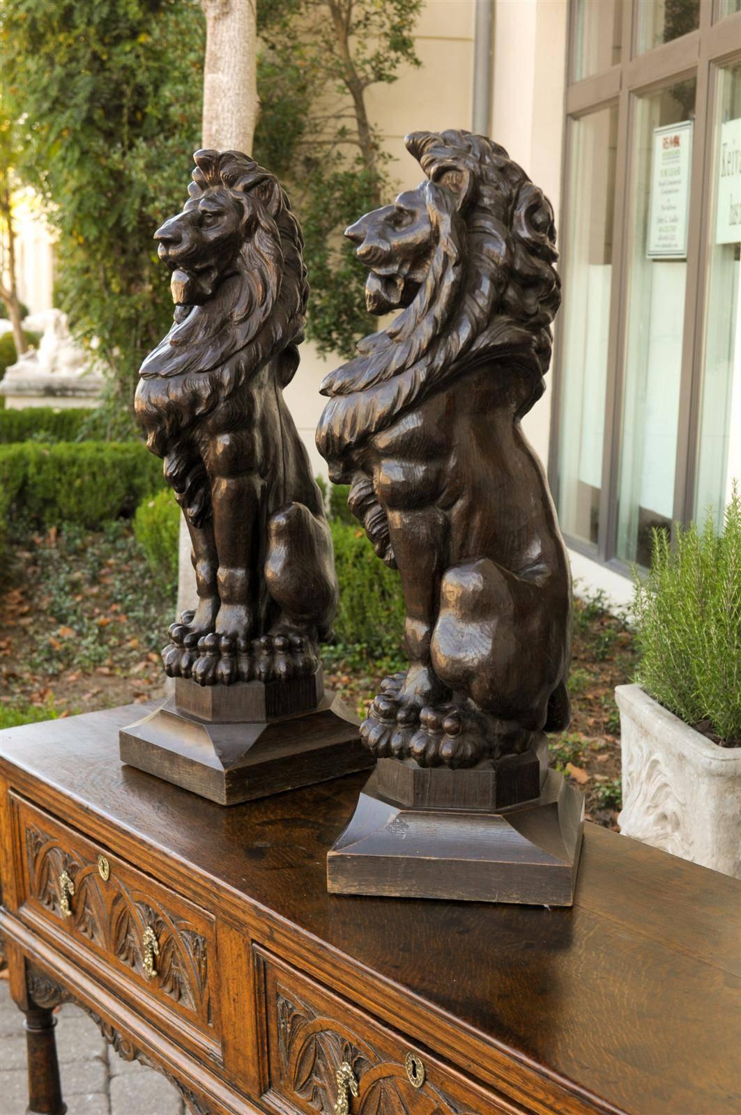 Pair of English Late 19th Century Large Wooden Carved Lions on Bases In Good Condition In Atlanta, GA