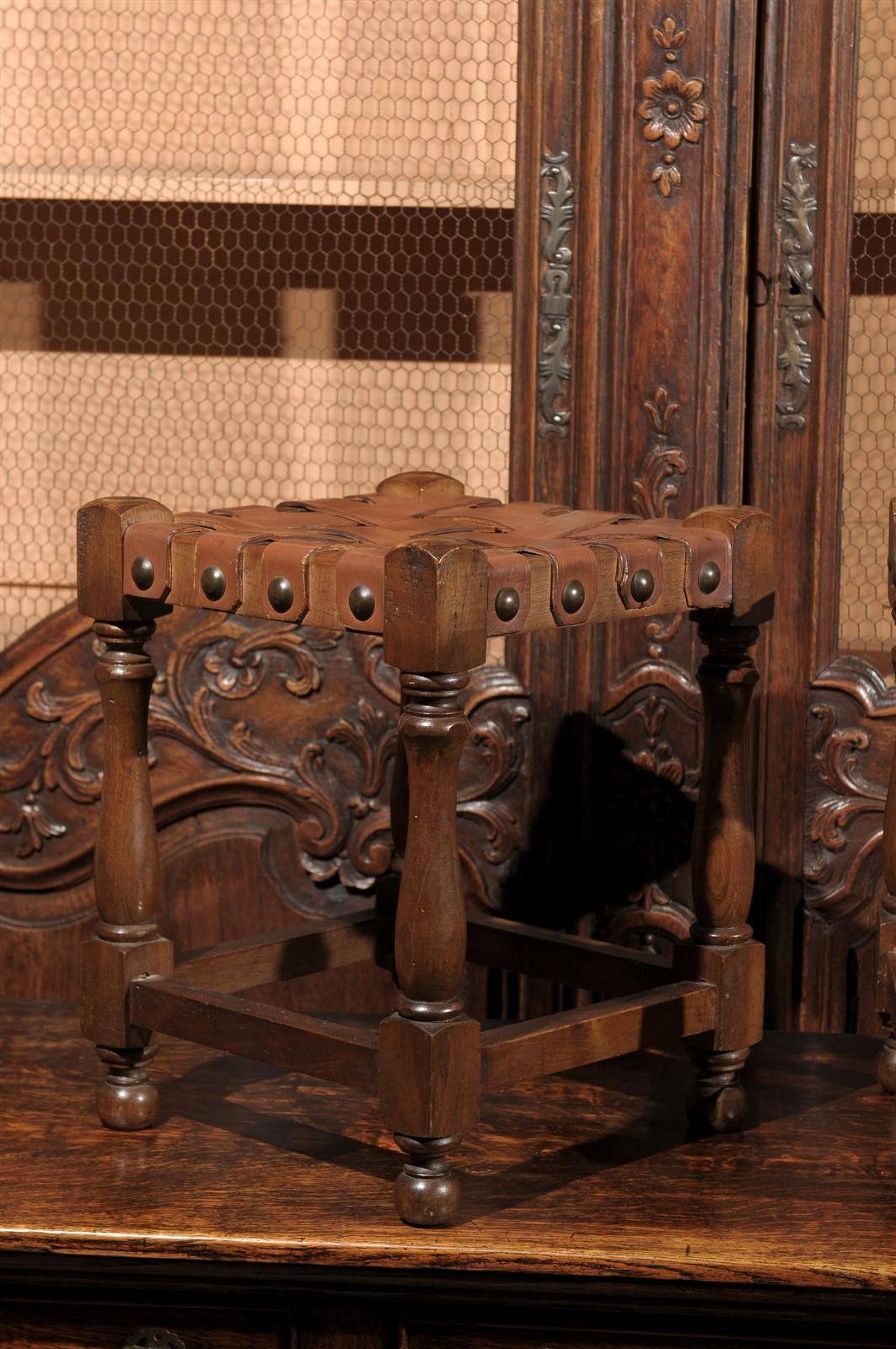 Carved French Wooden Stool with Woven Leather Top and Nail Heads, circa 1920