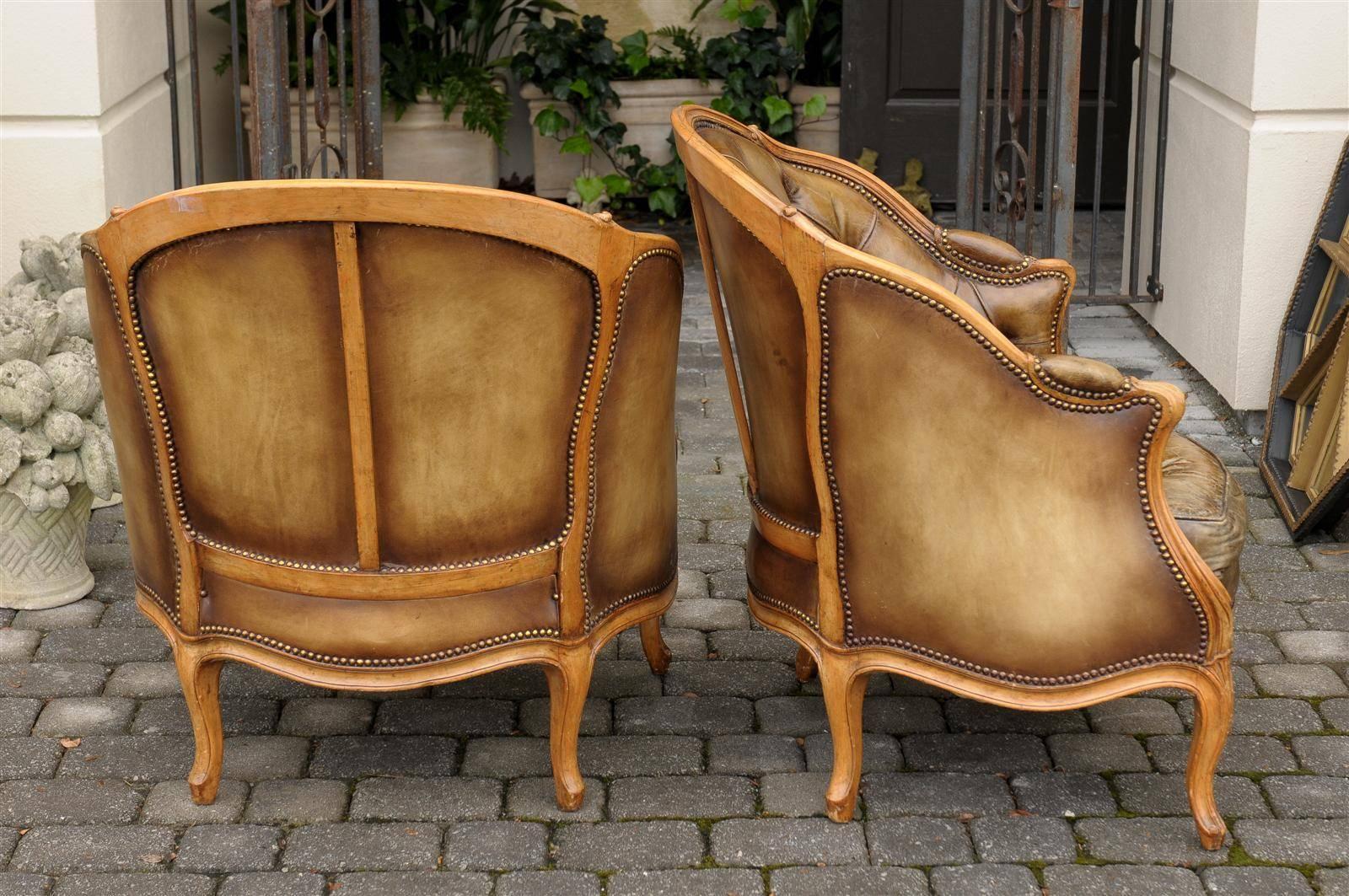Pair of 1940s French Louis XV Style Tufted Leather Barrel Back Bergeres Chairs In Good Condition In Atlanta, GA