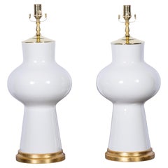 Pair of White Porcelain Table Lamps with Brass Mounts and Giltwood Bases