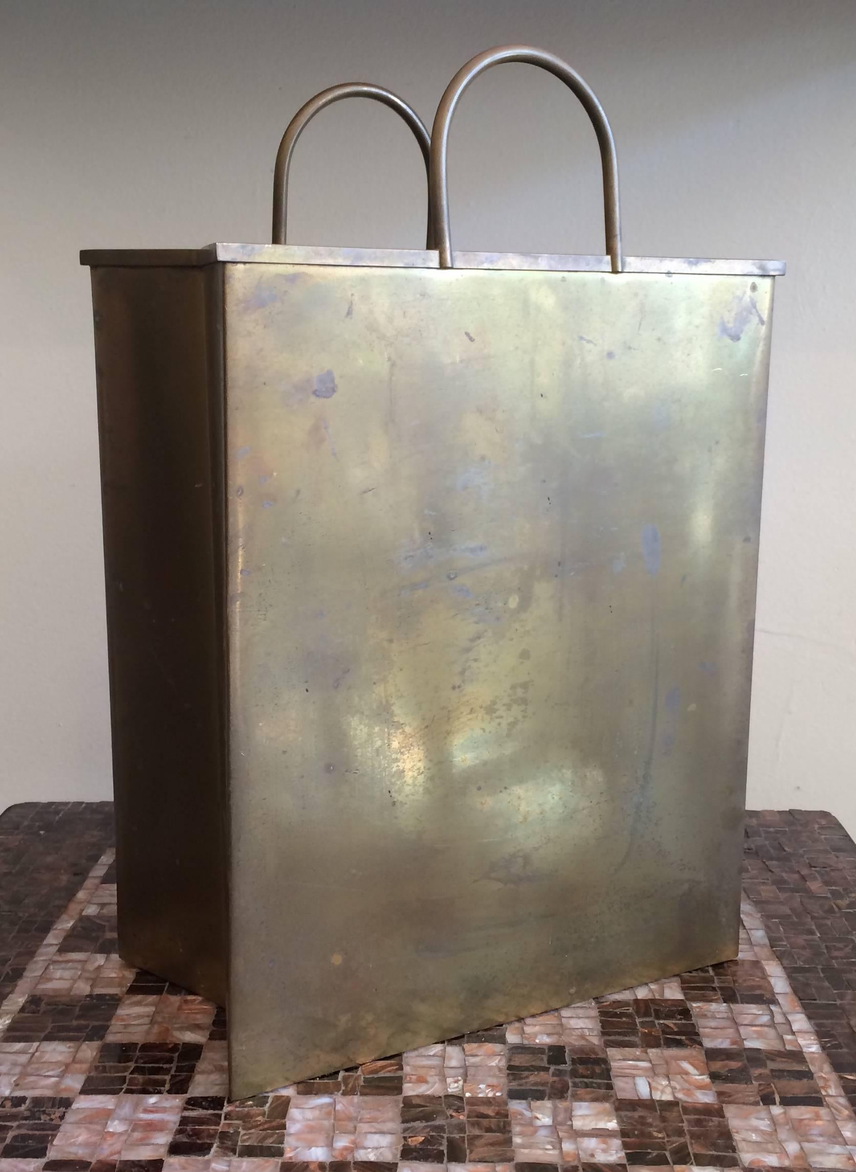 Solid brass shopping bag that can be used as either a magazine holder or wastepaper basket. Stamped 