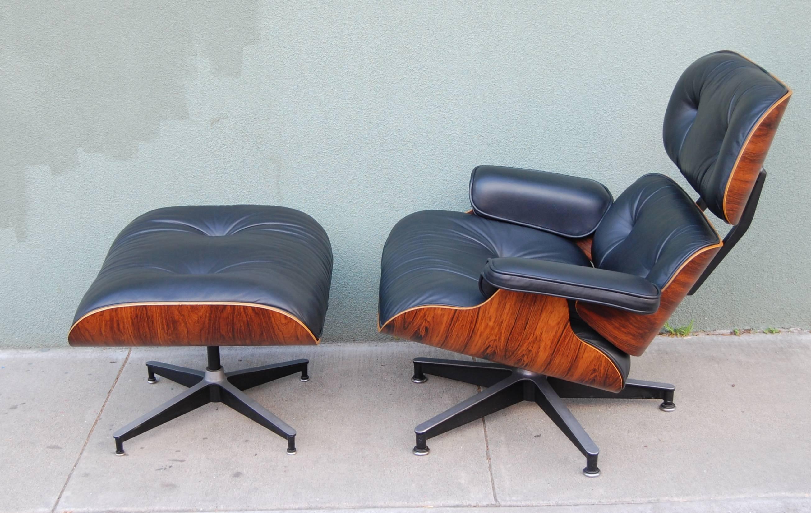 Late 1970s Eames lounge and ottoman, crafted out of Brazilian rosewood with plush black leather upholstery. Striking grain to the wood and extremely comfortable to lounge in, a stand out example. This has undergone a light restoration to the finish