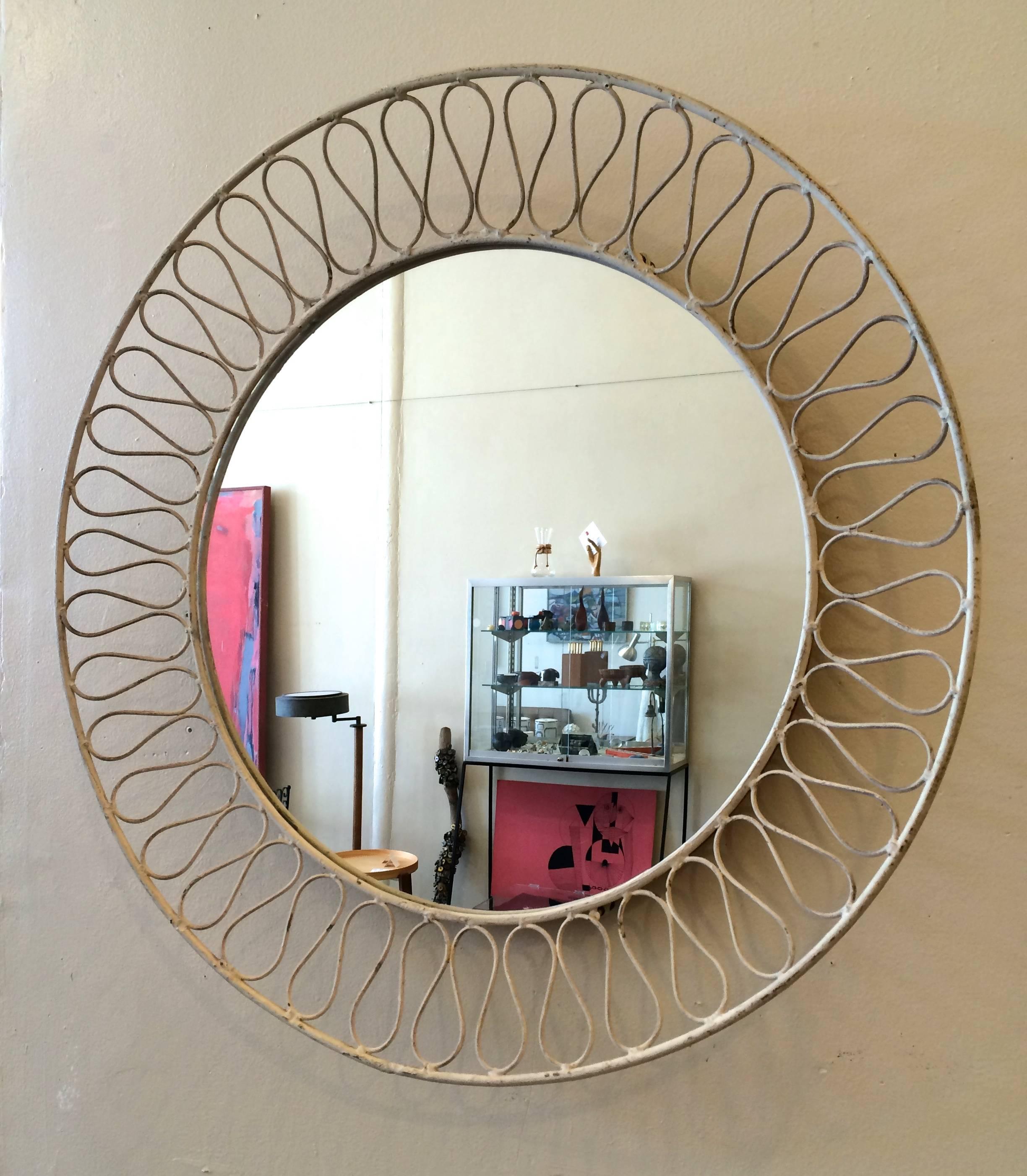 Iron wall mirror created by the Salterini iron works in the 1950s, possible Maurizio Tempestini design. The mirror can be used either as a wall mirror or as a tray, all original finish with patina to the painted iron.
