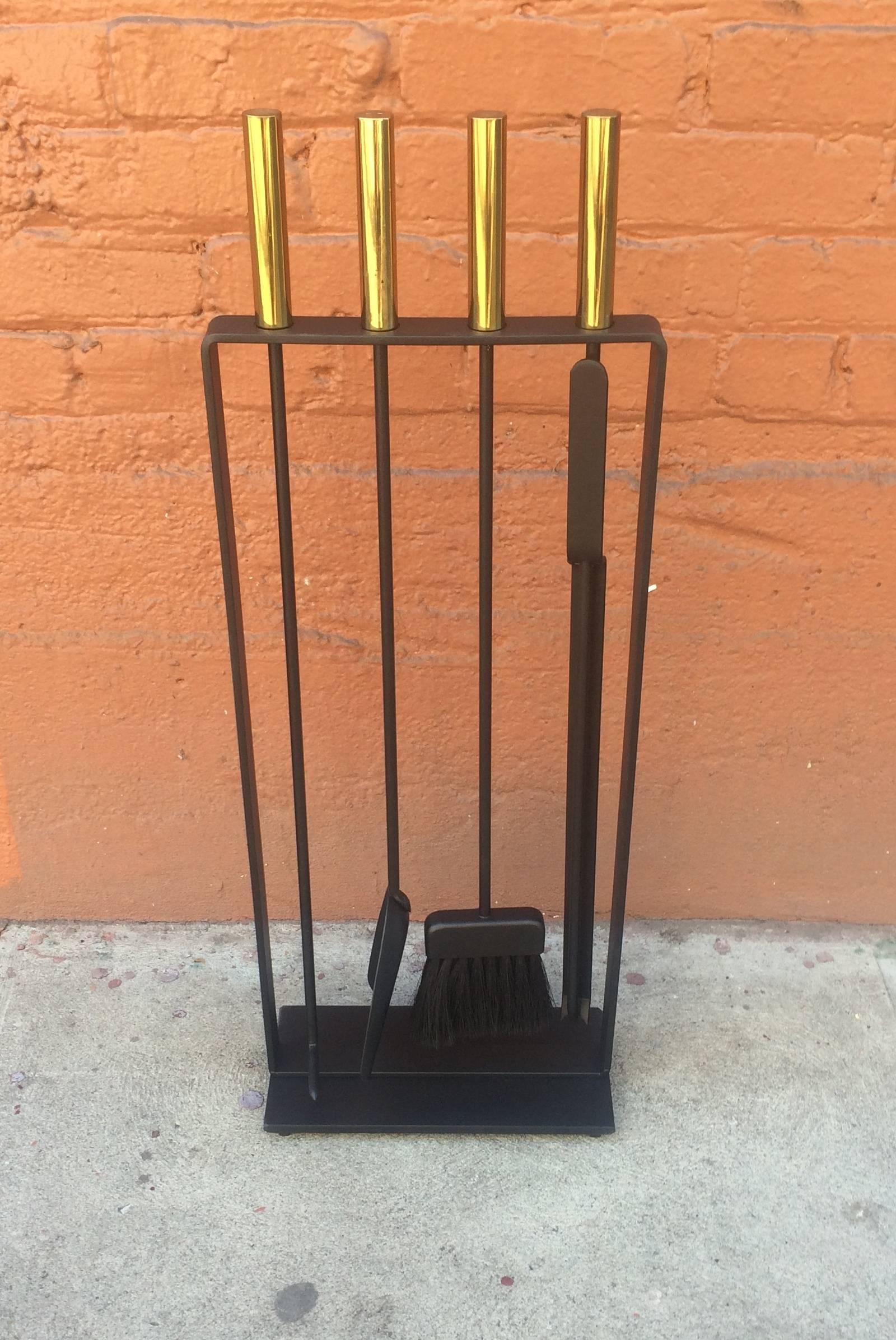 Fireplace tools by Pilgrim with solid brass handles, consisting of a poker, brush, pan and tongs, newly sprayed in a flat black.