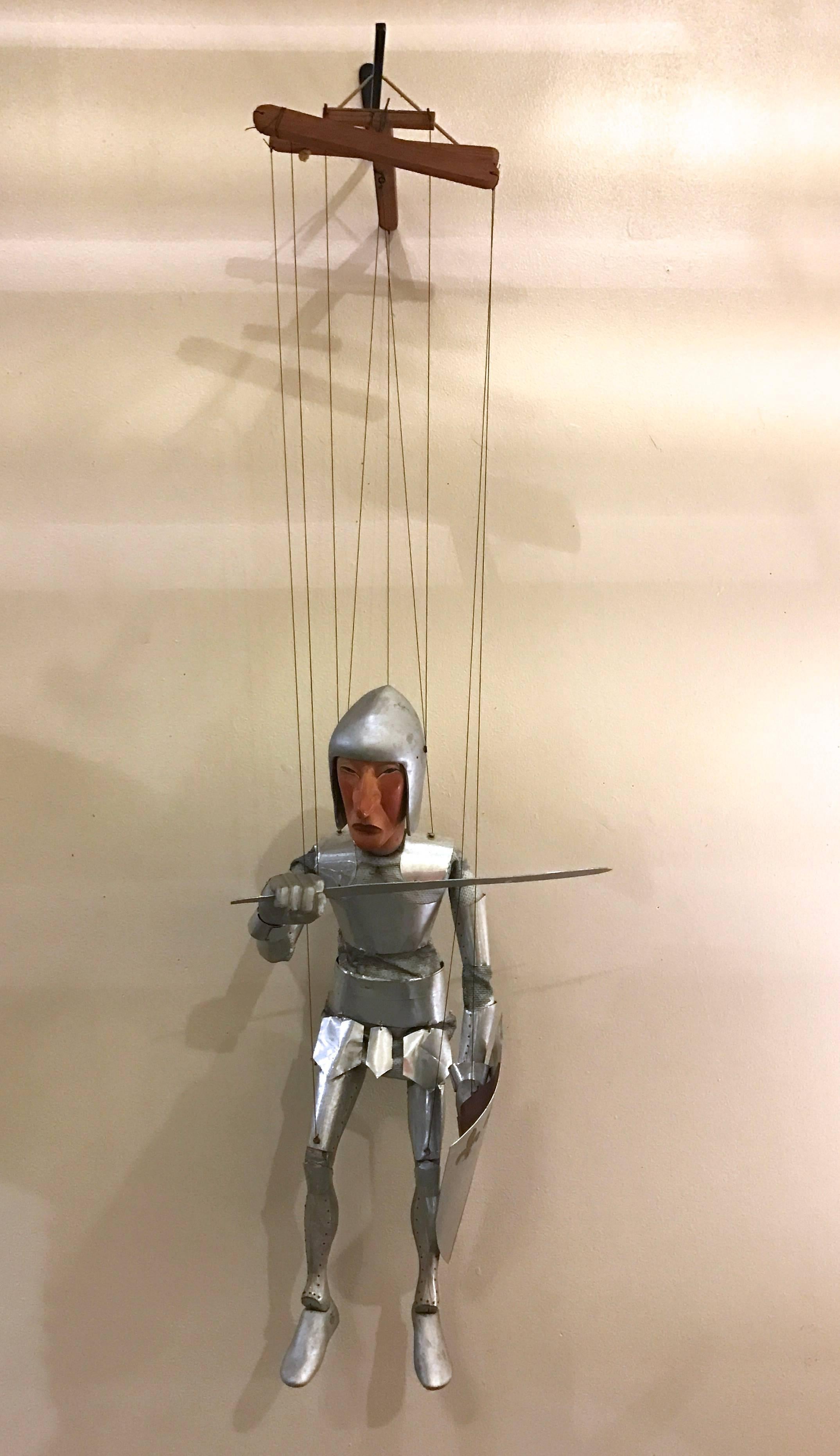 Handcrafted puppet of a Medieval Knight by Californian artist Stan Felman, known for his ceramics and wall sculptures created this Knight of the Roundtable out wood, fabric and aluminum. Amazing amount of detail and craft to its creation, the hand