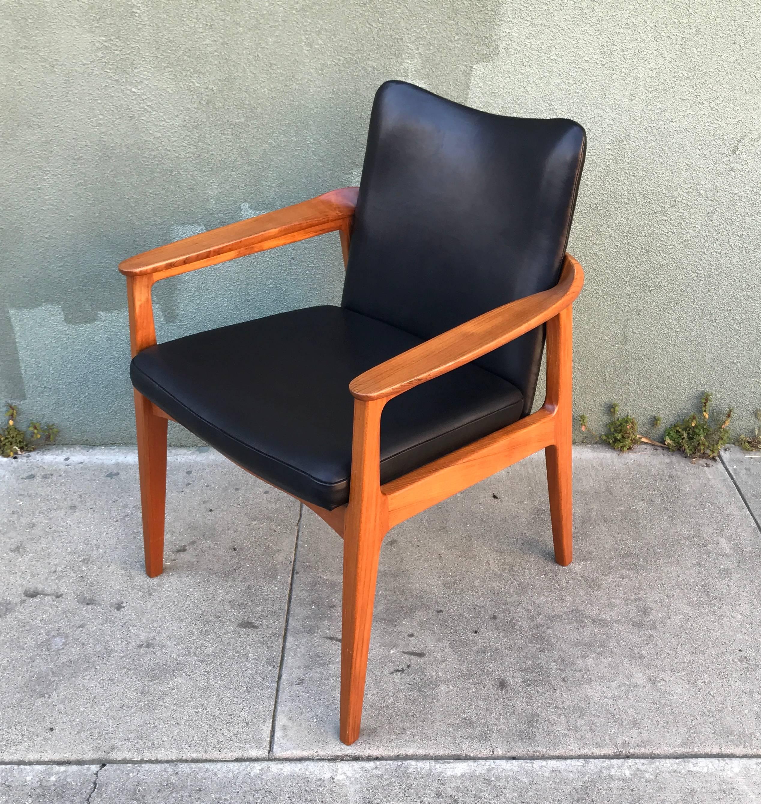 The Count Sigvard Bernadotte designed teak armchair, crafted by France and Son in Denmark and imported by John Stuart Inc of New York. Solid teak frame the has been restored along with premium leather upholstery for a full restoration. Labeled with