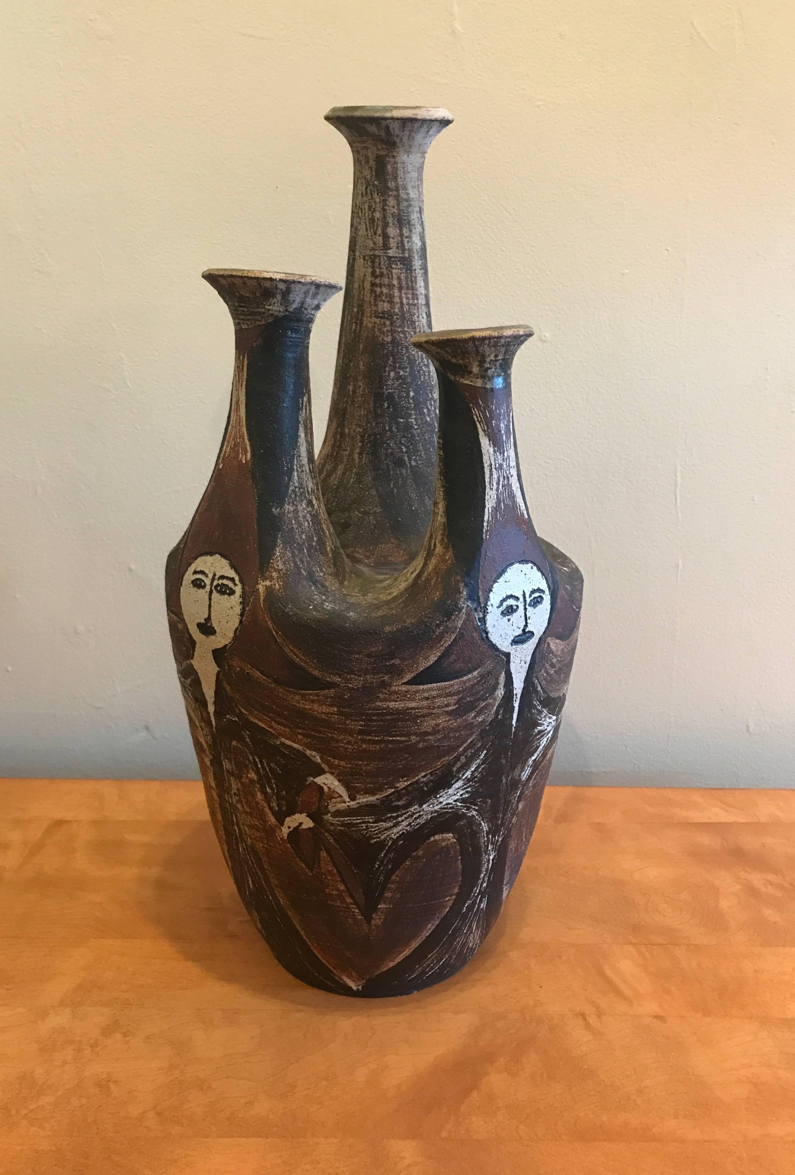 Ceramic artist Joseph Hysong (1925-2008) three spout vessel with three female figures glaze applied and etched onto the clay, the color of the glaze is a mixture of various earth tones. Joseph Hysong started the ceramics program at Monterey