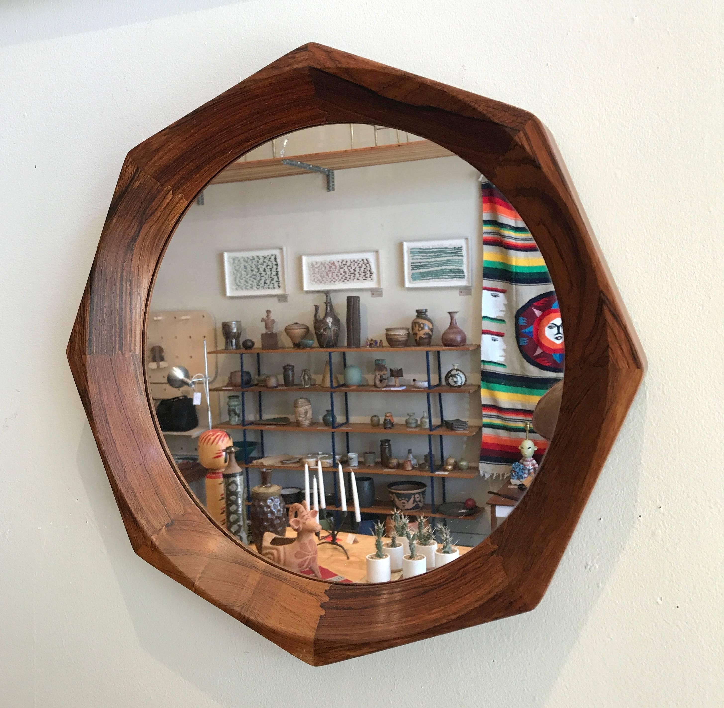 Solid rosewood framed Danish octagon wall mirror from the 1960s, beautiful construction with unique joinery. In great vintage condition with expressive graining to the wood.