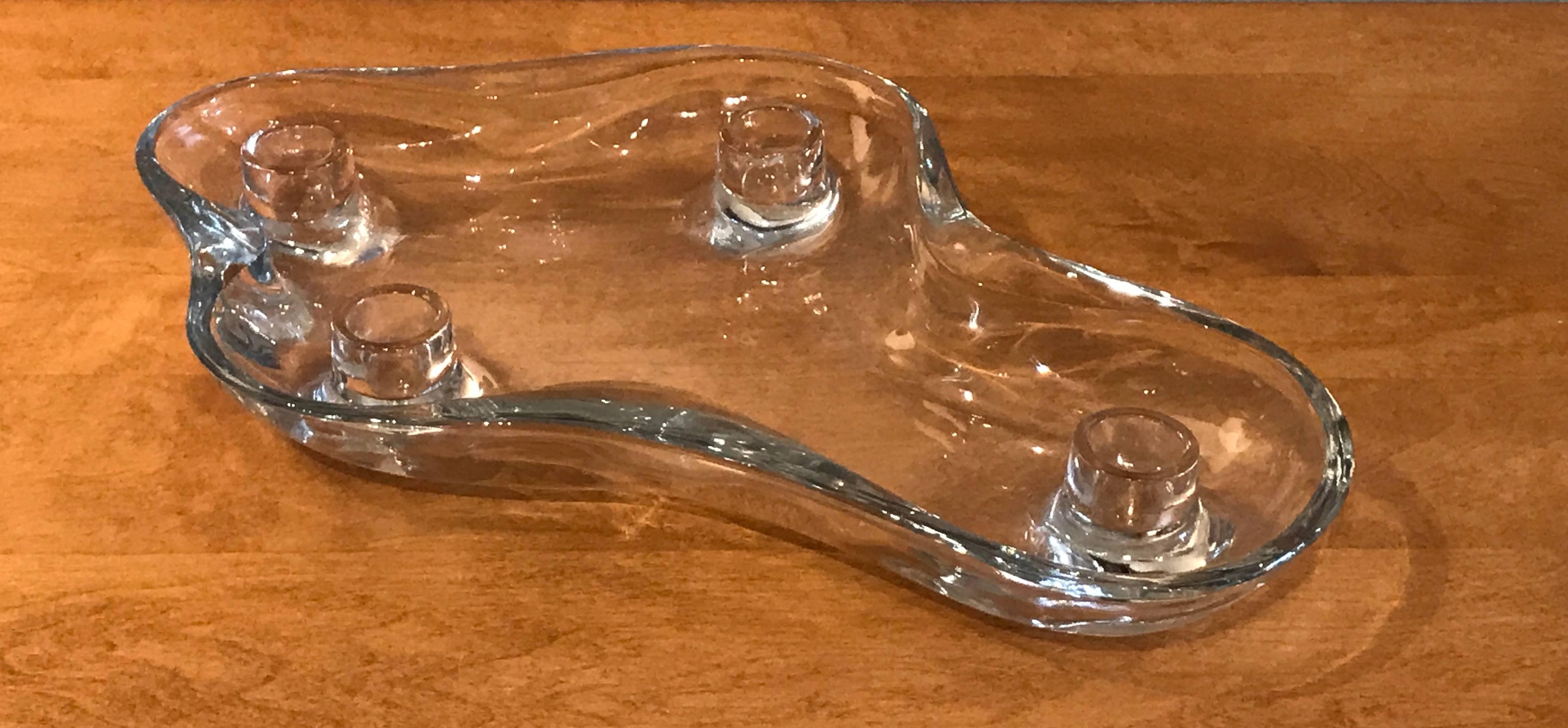 Candleholder and flower floater by Finnish-emigre compatriot Eva Lisa Saarinen Swanson with its elegantly curvilinear form of 1948-50 for the U.S. Glass Company one of the early biomorphic designs put onto the market for Post War American home. The
