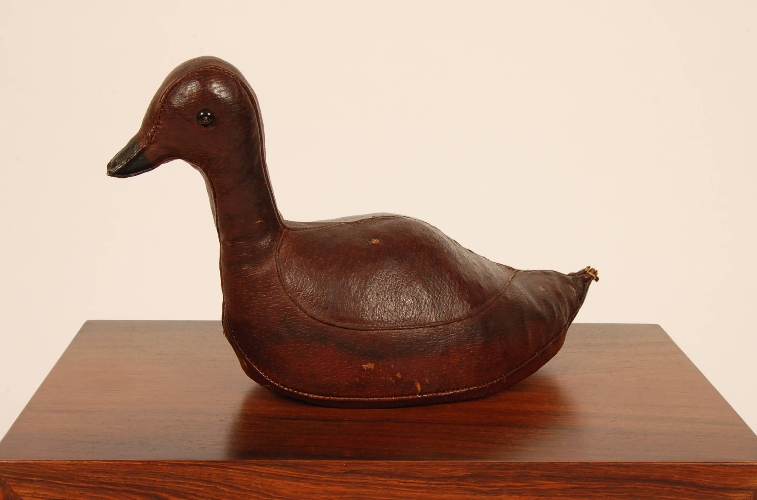 Handcrafted leather duck decoy created for Abercrombie and Fitch circa 1960s. Wonderful patina to the leather and a intricate level of craft in its construction.