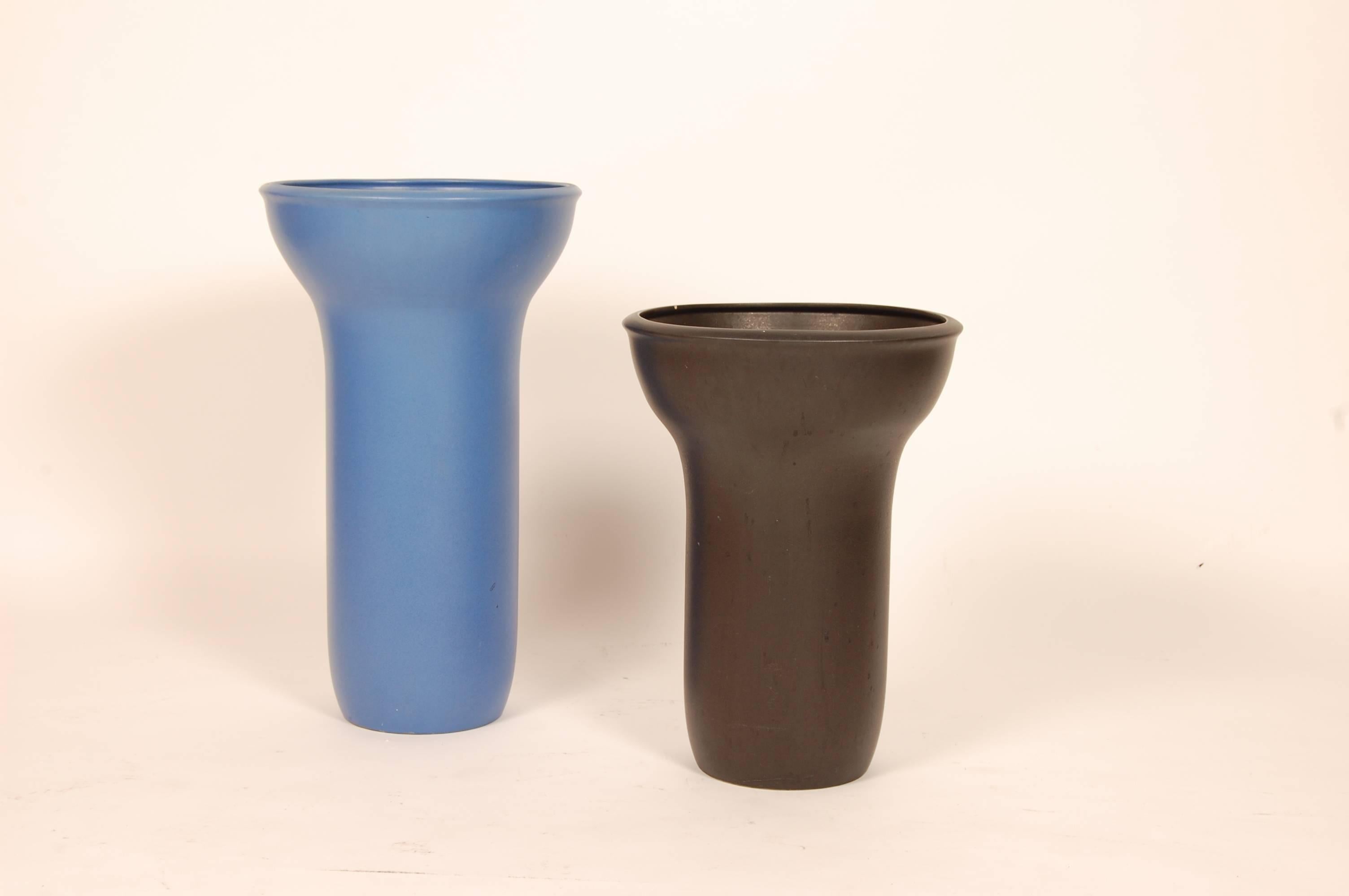 Pair of rare Raul Coronal ceramic planters for Architectural Pottery, circa 1960. One planter is a matte blue glaze (SOLD) and the other is a matte black. Can be purchased either as a pair or separately. The black planter measures 13.75