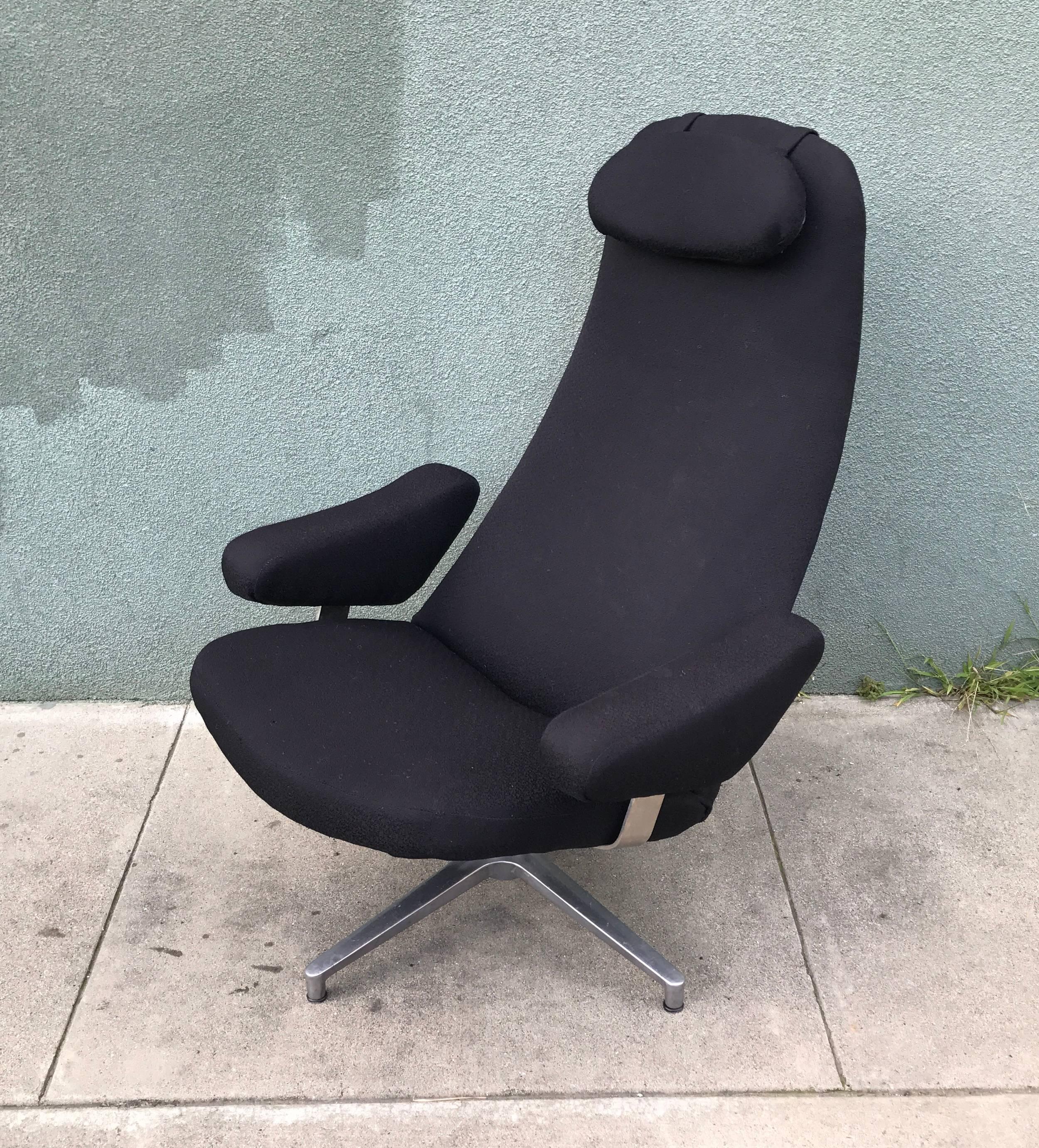 Swivel lounge chair by Swedish designer Alf Svensson (1929-1992), a biomorphic design with floating armrests and a four star aluminum base, having older upholstery that is serviceable, we do have an access to an upholster who is a true craftsman if