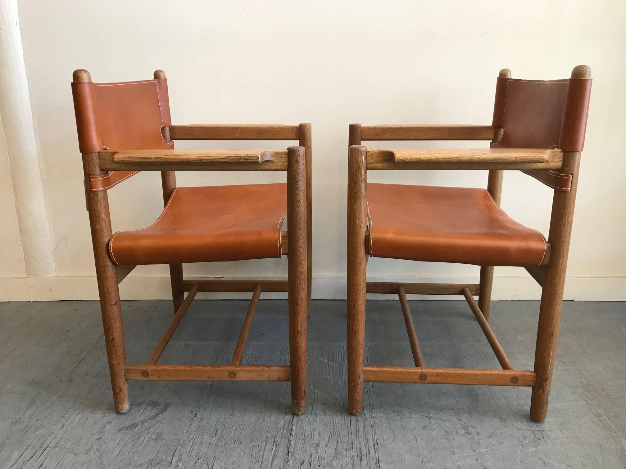 Beautiful safari chairs designed by Børge Mogensen, circa 1960s, Denmark. Seats are fully adjustable. New leather hides.