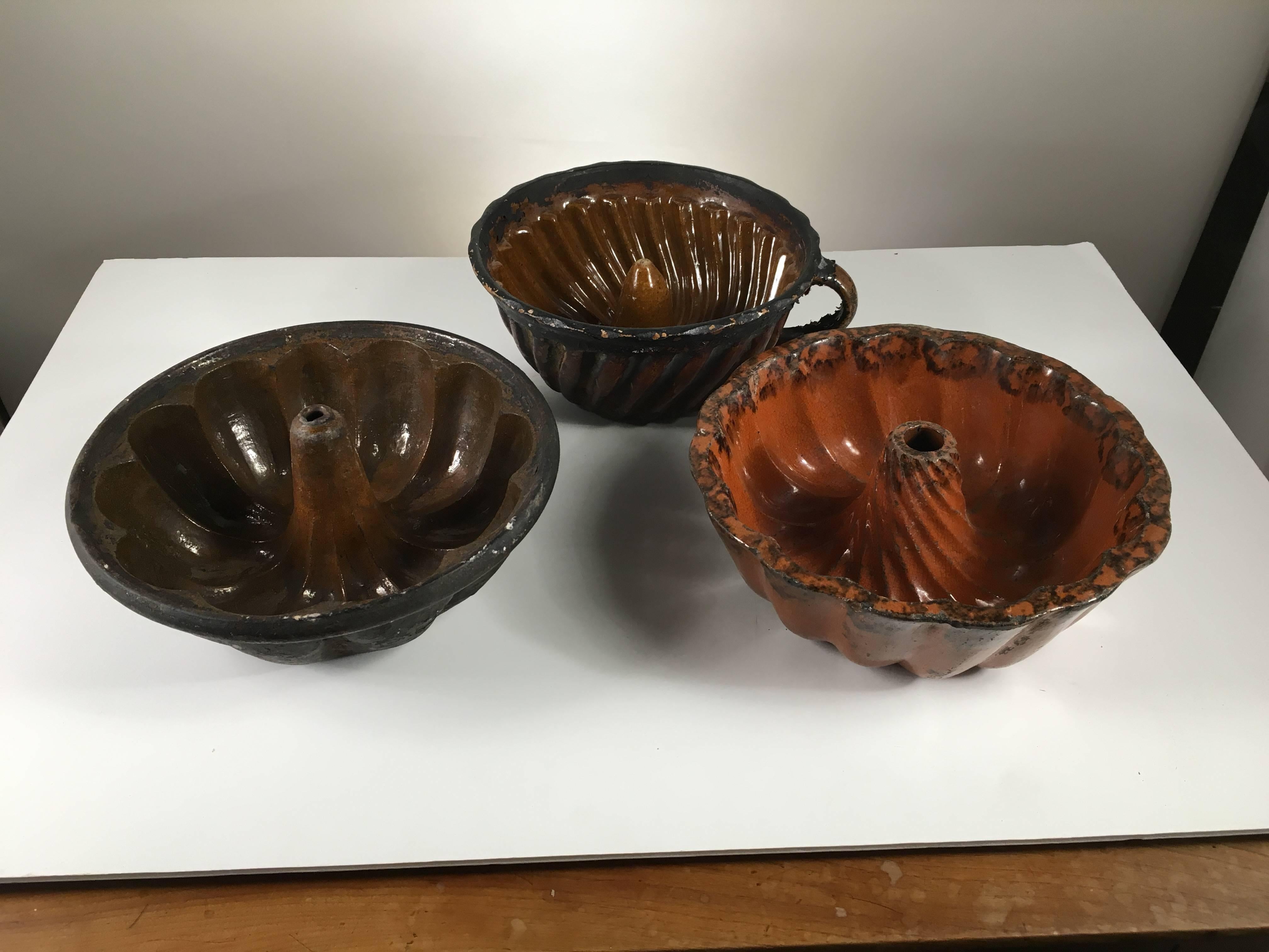 A nice collection of Primitive country cake molds, Pennsylvania Redware, called 