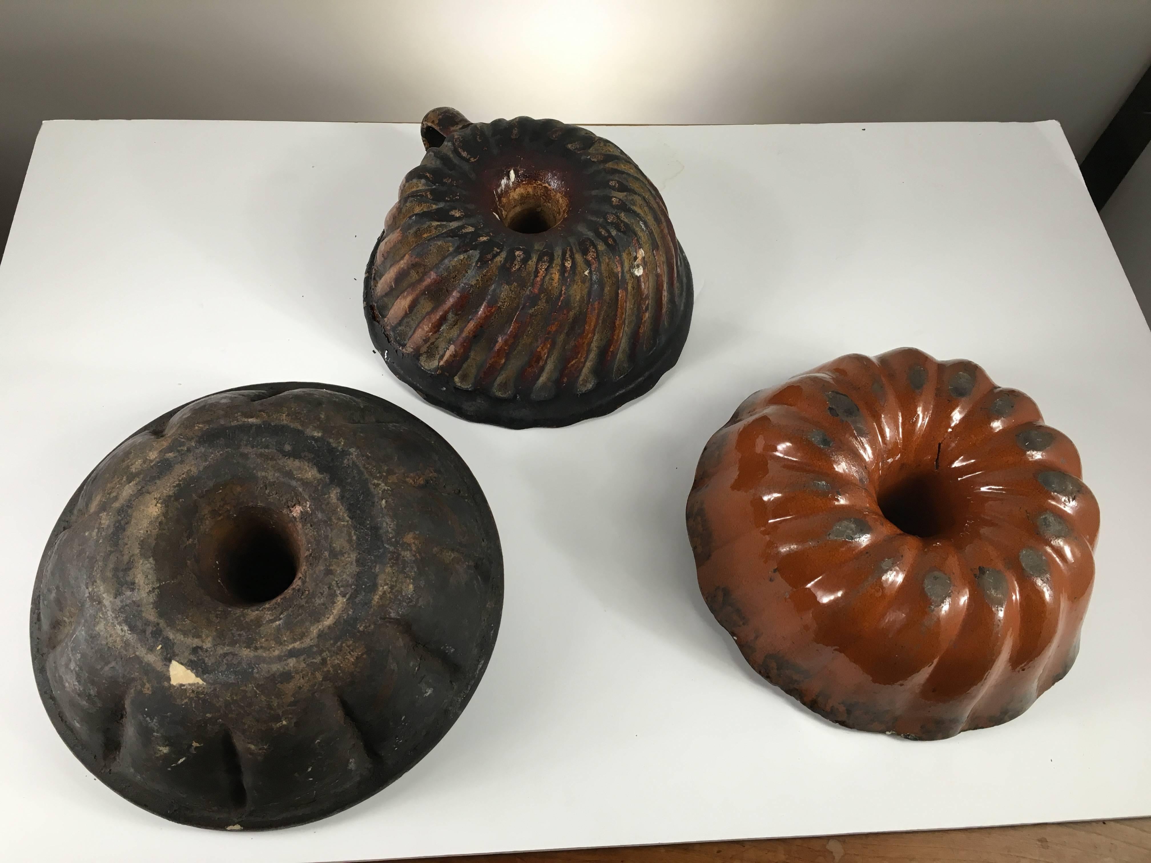 American Collection of Three Early Pennsylvania Redware Cake Molds, 19th Century