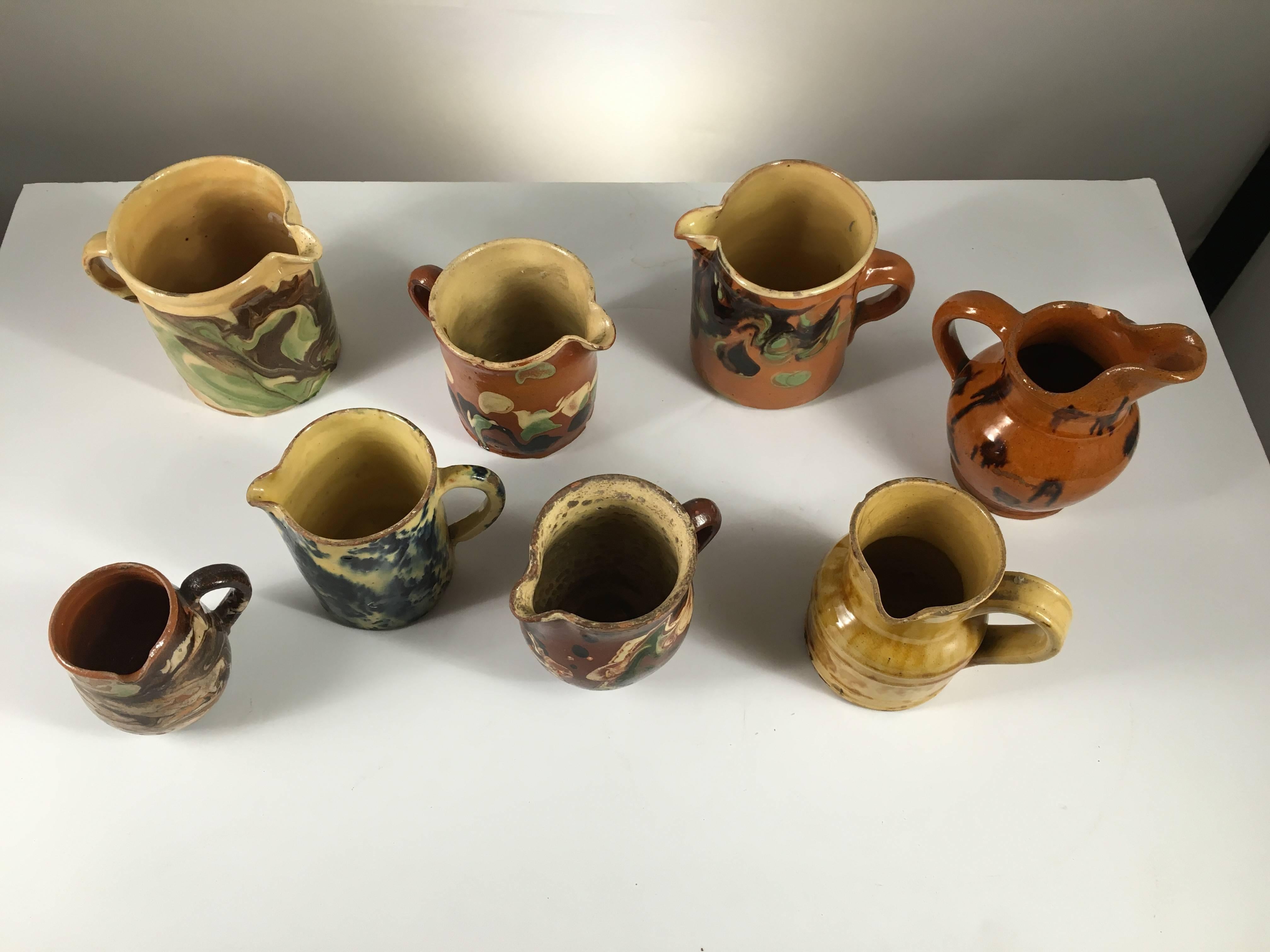 Pottery Collection of Eight Small French Provincial Jaspe Cream Pitchers, 19th Century