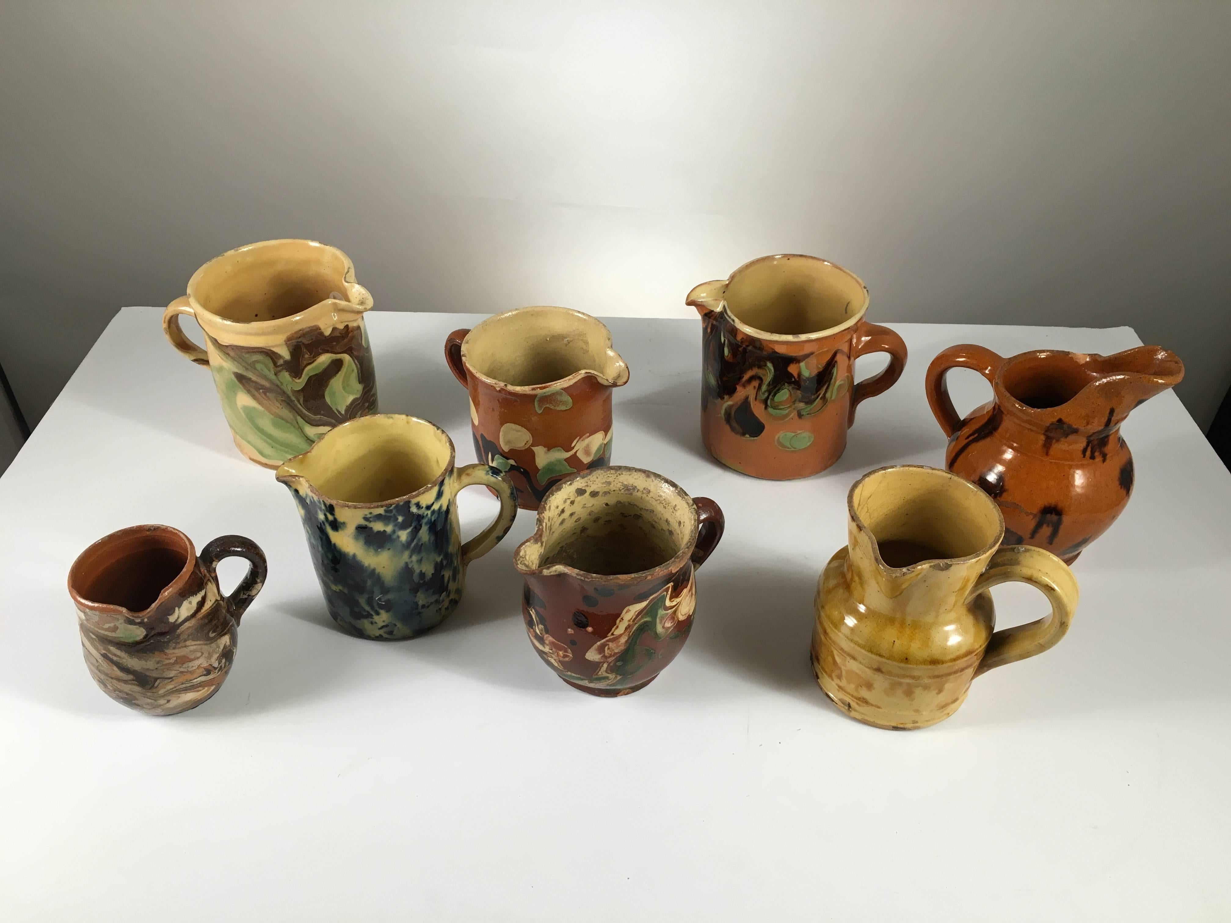 Collection of Eight Small French Provincial Jaspe Cream Pitchers, 19th Century 1