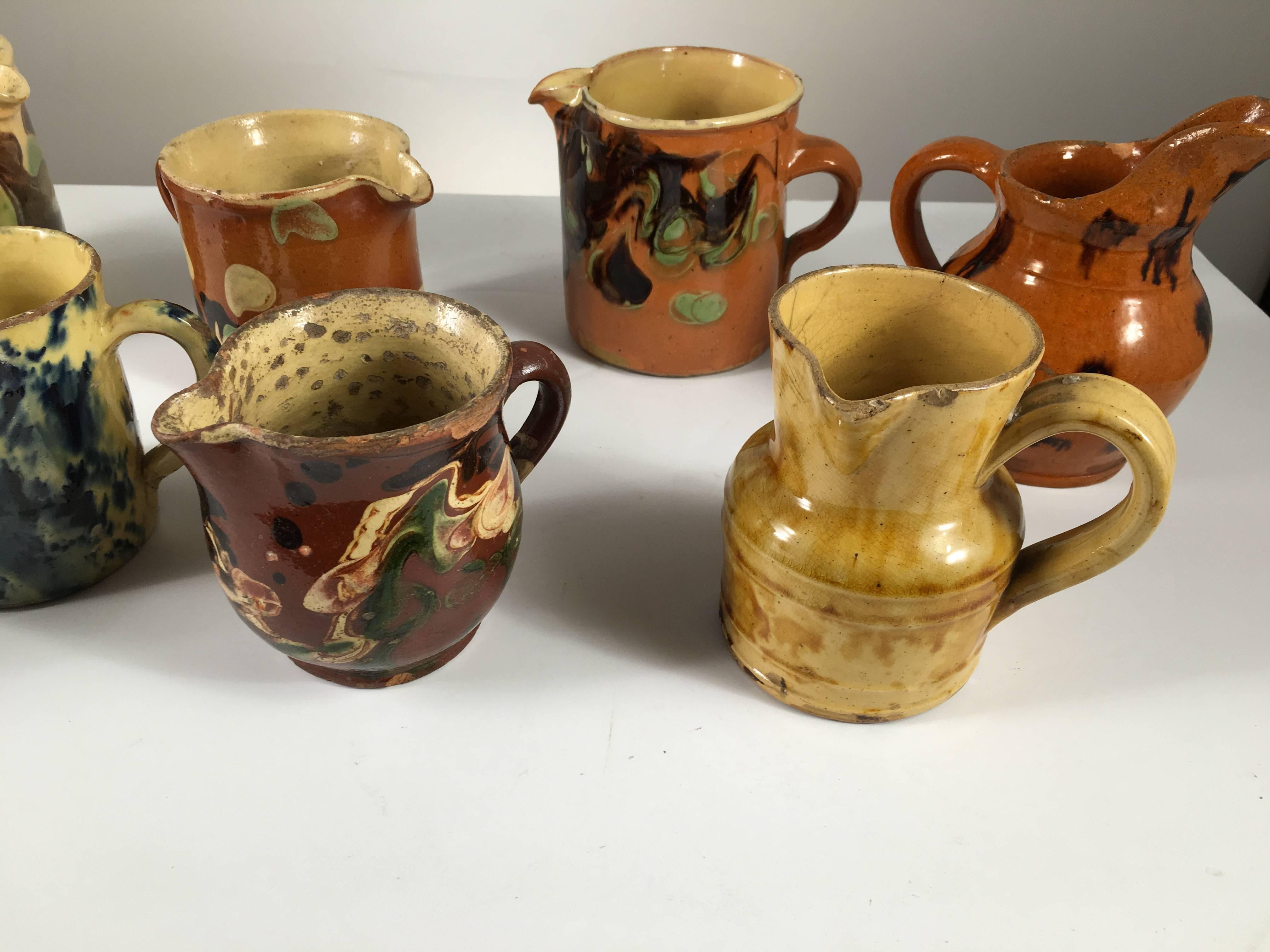 Collection of Eight Small French Provincial Jaspe Cream Pitchers, 19th Century 6