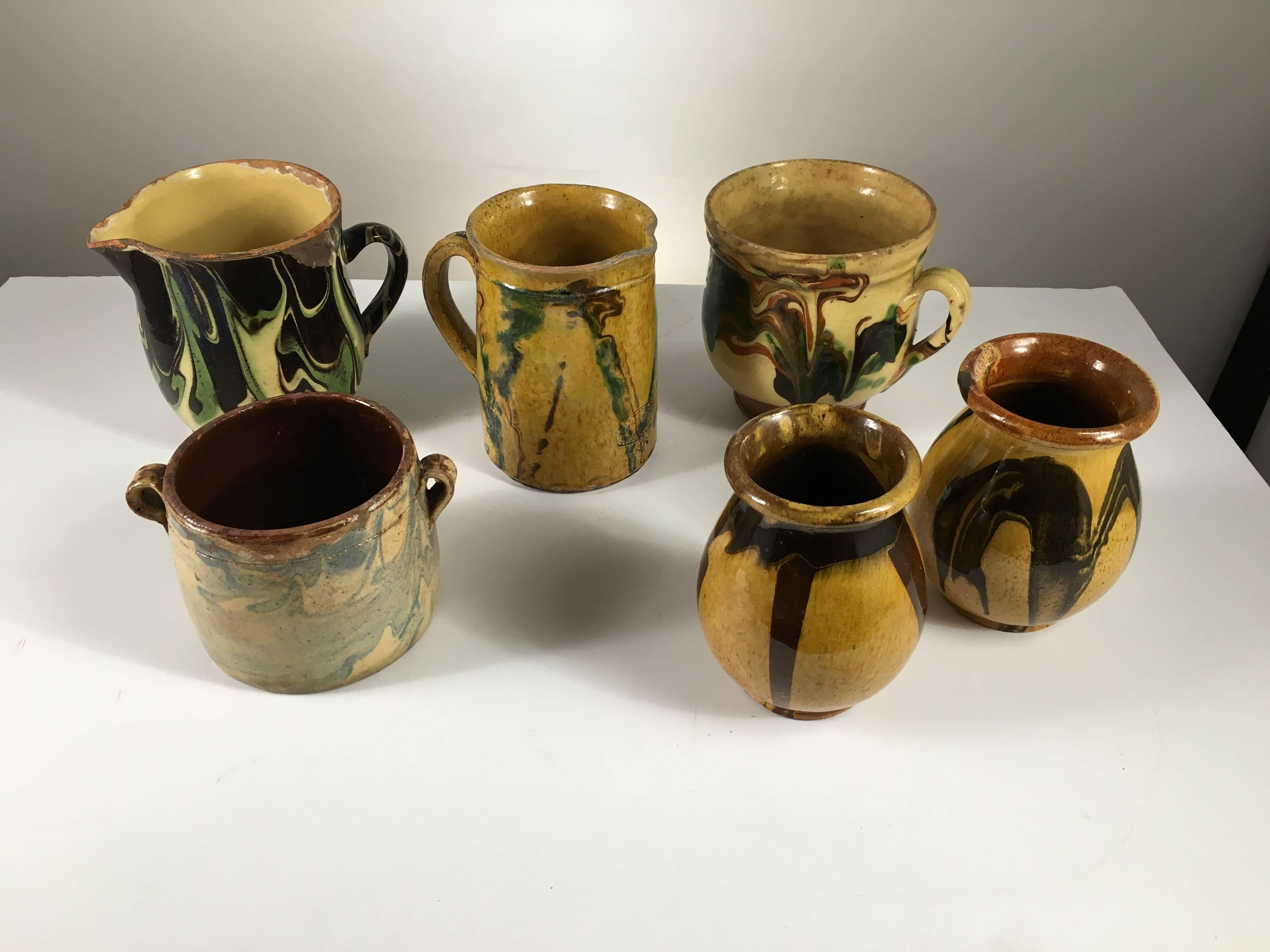A nice collection of French six provincial Jaspe pots and pitchers from the Savoire region, late 19th century, from the collection of Pierre Moulin, author of French Country style books and founder of the Pierre Deux shops.
