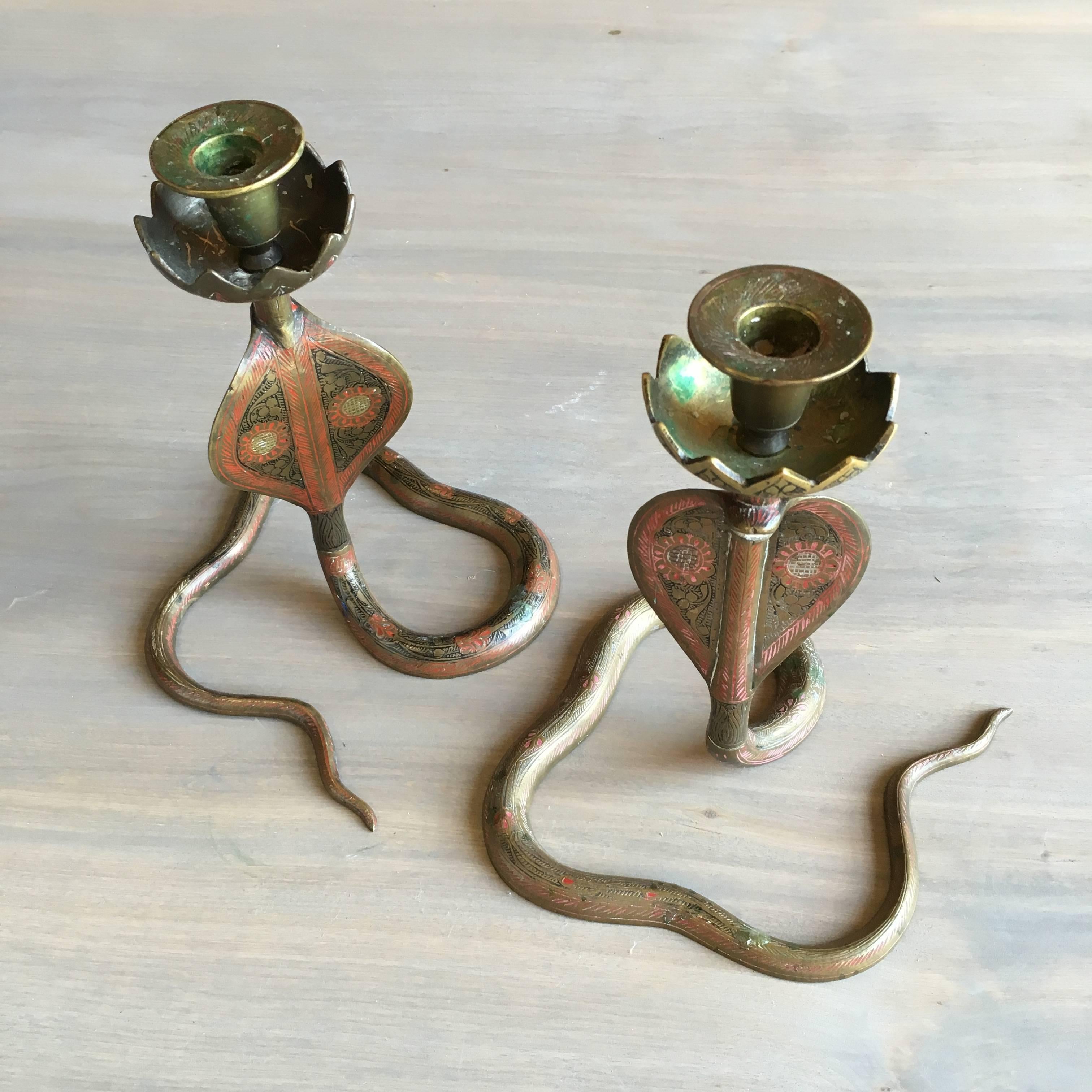 Pair of cobra form candlesticks in brass with enamel decoration, Moroccan, circa 1940.