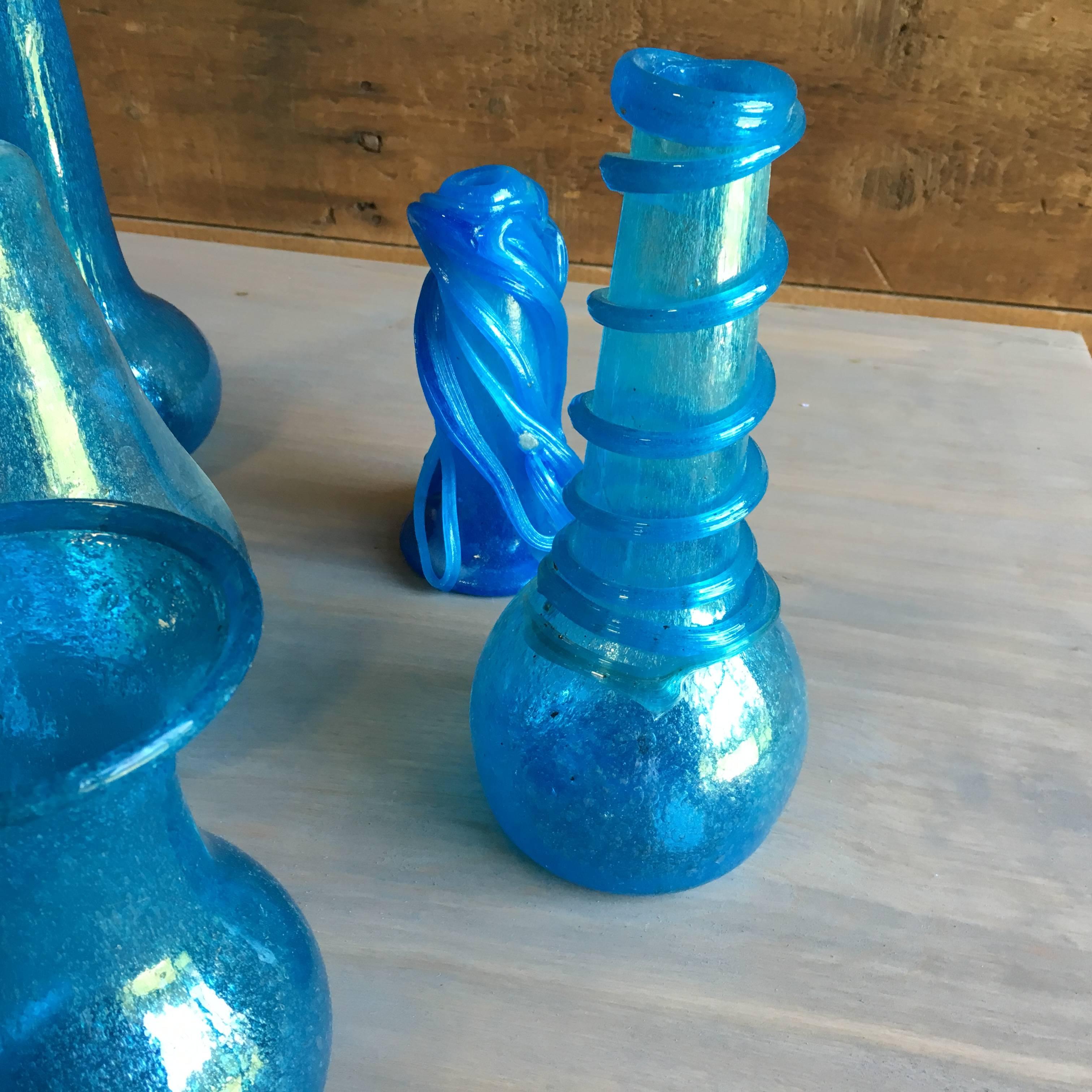 A collection of twelve pieces of blown glass vases, bowls and jars from Herat, Afghanistan, the last place glass is produced according to ancient techniques (ref: Corning Glass Museum).