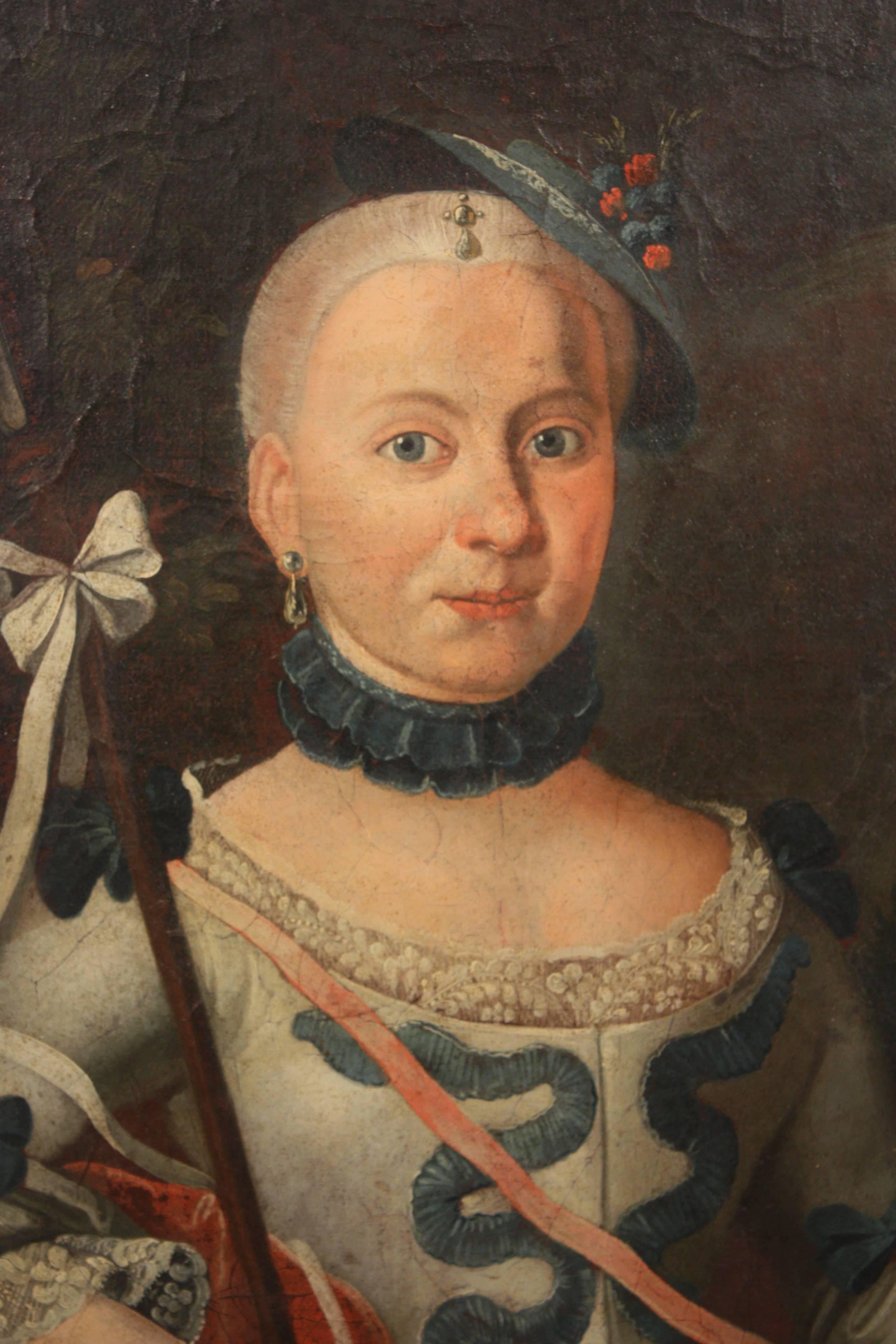 An early to mid 18th century oil-on-canvas portrait of a Lady in a white gown with blue trim and a red robe, holding a staff and wearing a small hat.  Unframed.