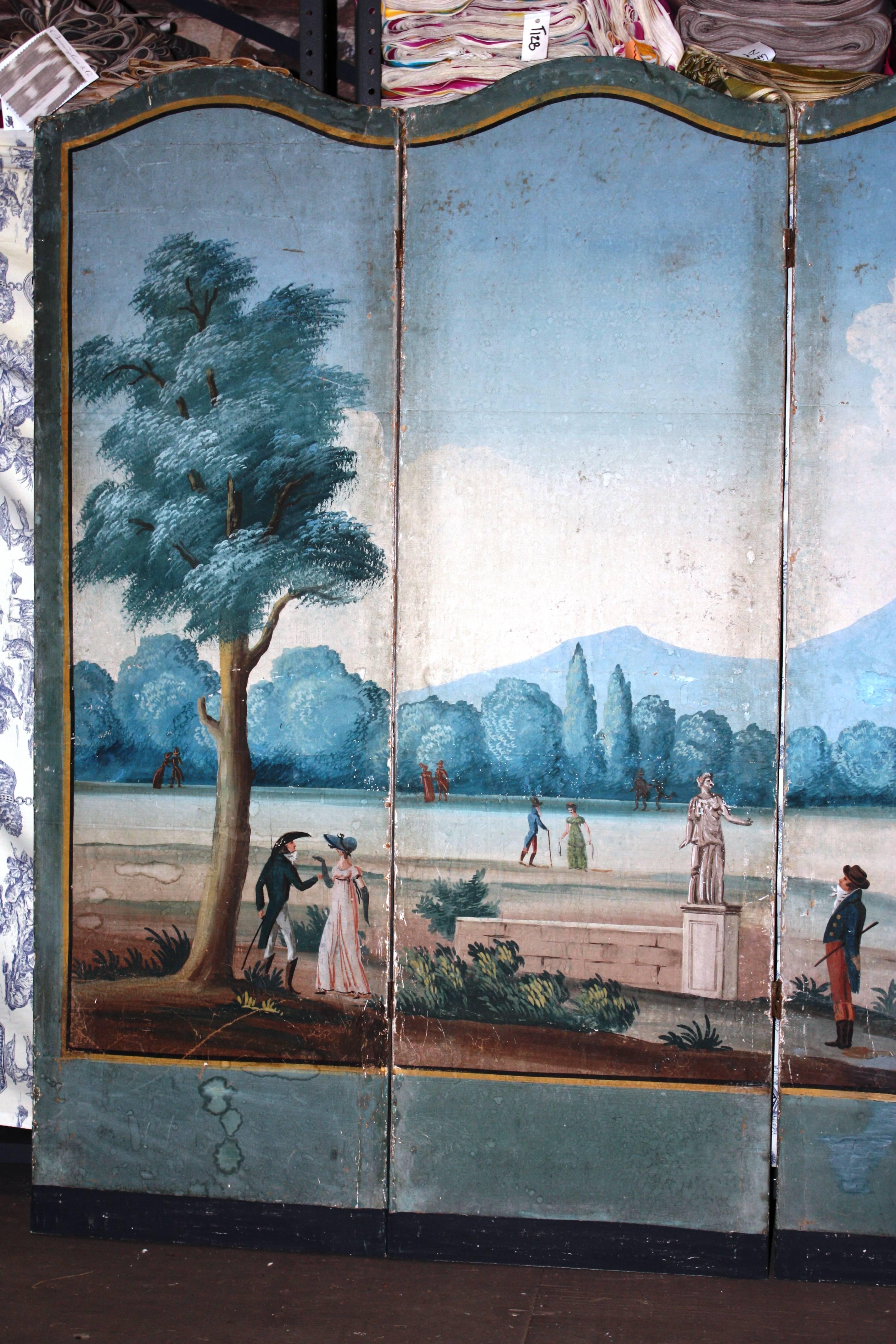 A charming and naively painted Directoire Period 4-panel wallpaper screen, depicting a country estate with strolling guests, circa 1800, French. The reverse is painted 