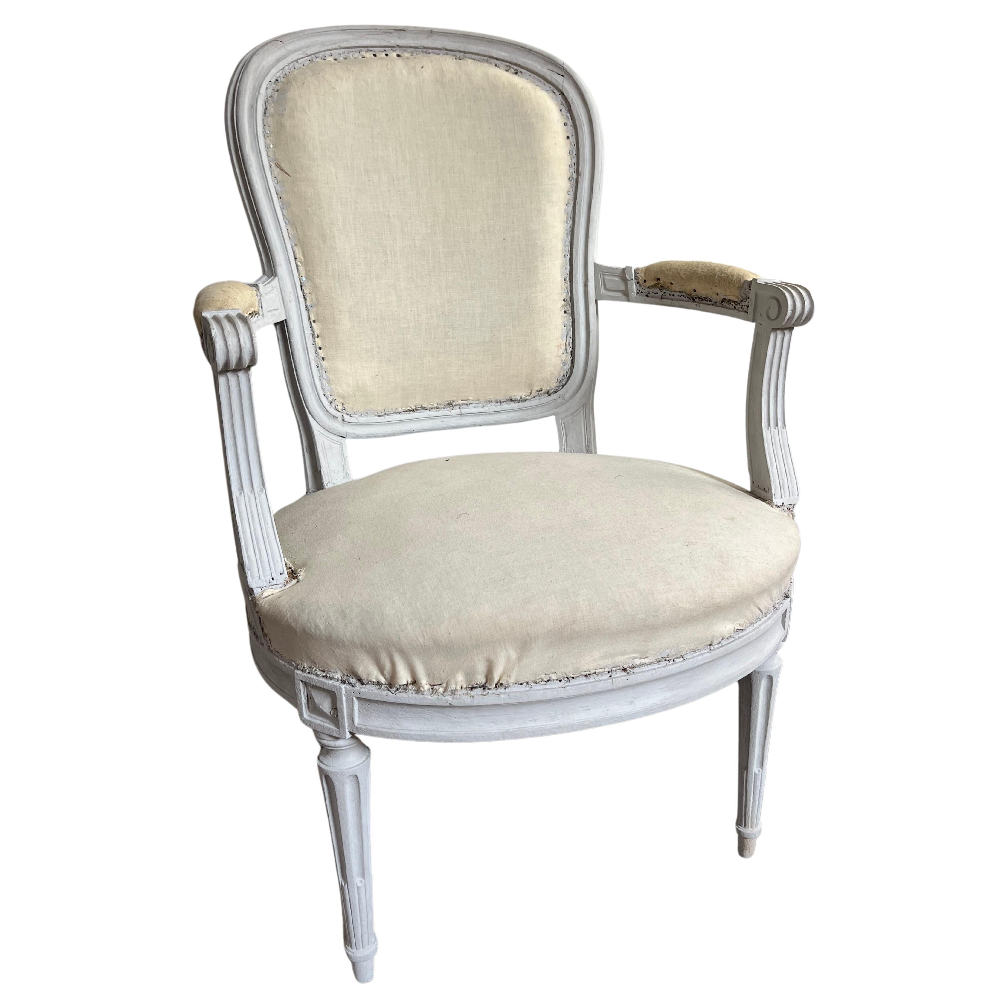 A set of 6 Louis XVI Period fauteuils circa 1790 with medallion backs and fluted legs, in light grey painted finish, recently upholstered and ready for cover fabric. Each chair is signed on the seat stretcher “F. Lapierre a Lyon”. Can be used as