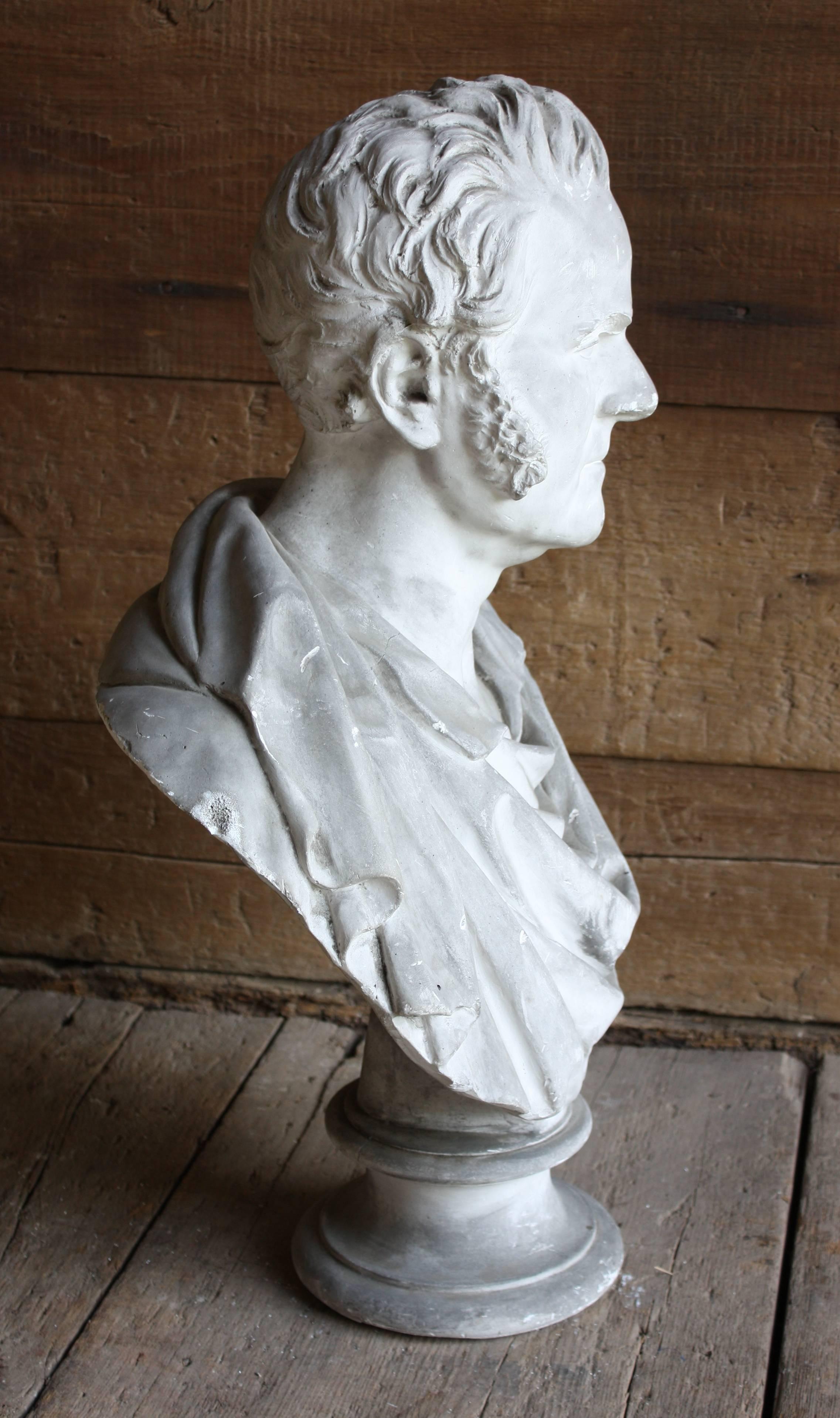 A great mid-19th century neoclassic bust of a gentleman in plaster.