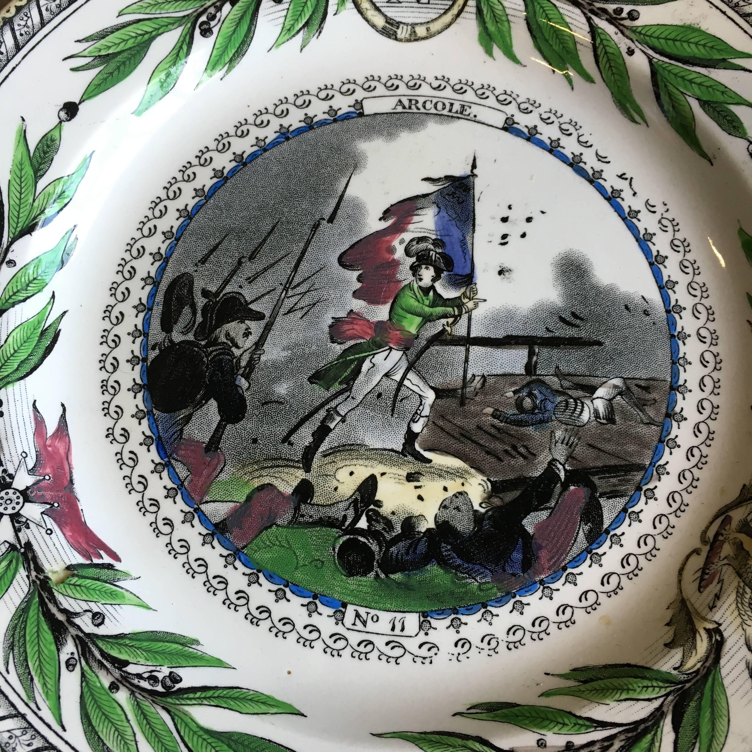 A set of four Creil Montereau decorative plates illustrating the battles and exploits of Napoleon, circa 1870. Signed on reverse of each.