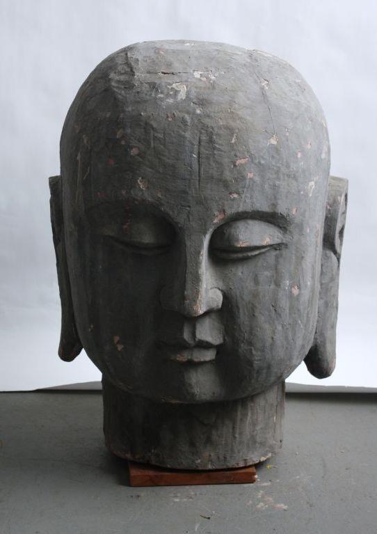 large wooden buddha head