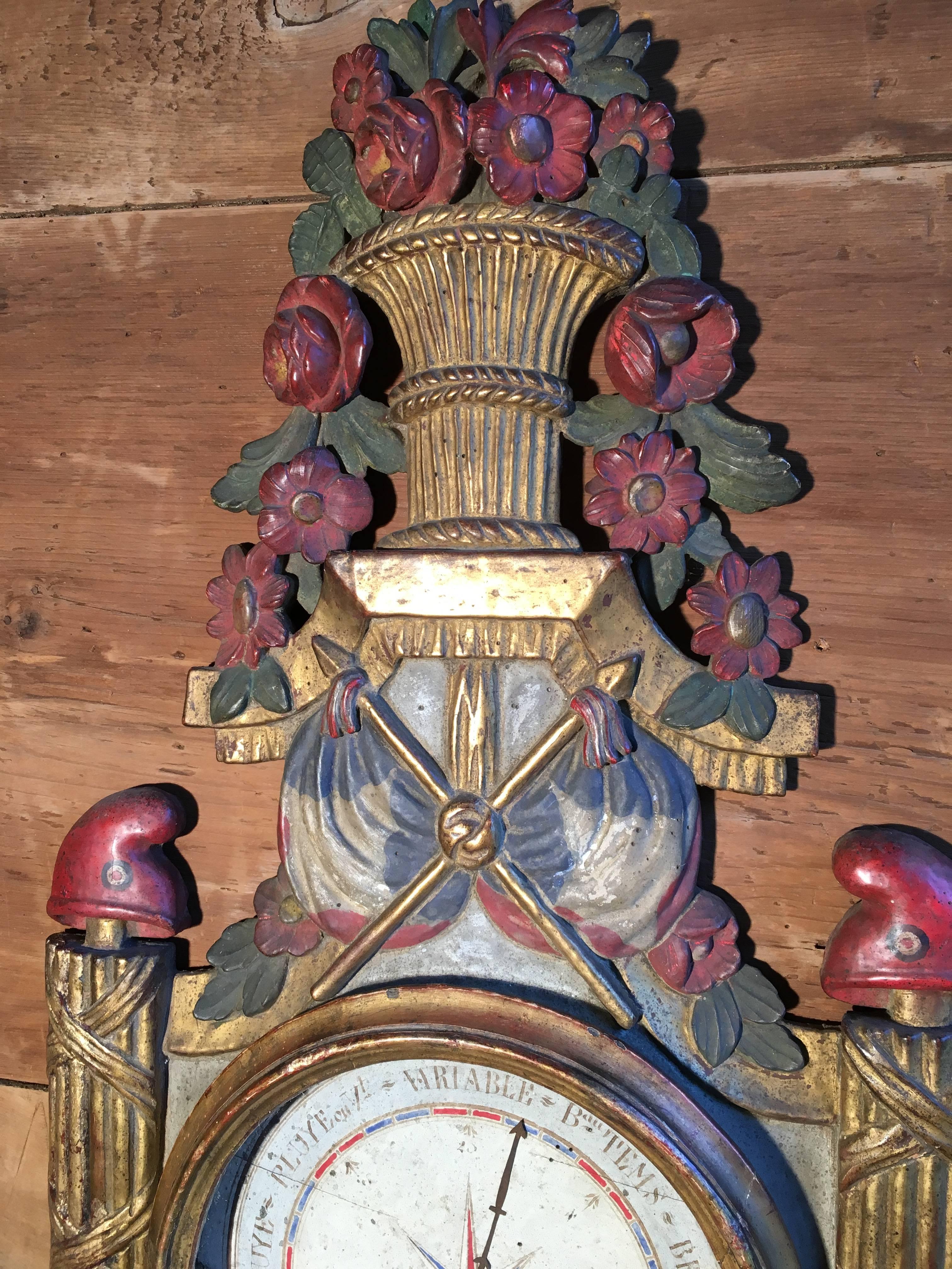 A rare, possibly unique, French revolution era wall barometer in the Louis XVI style, giltwood and painted decoration showing various revolutionary symbols including 