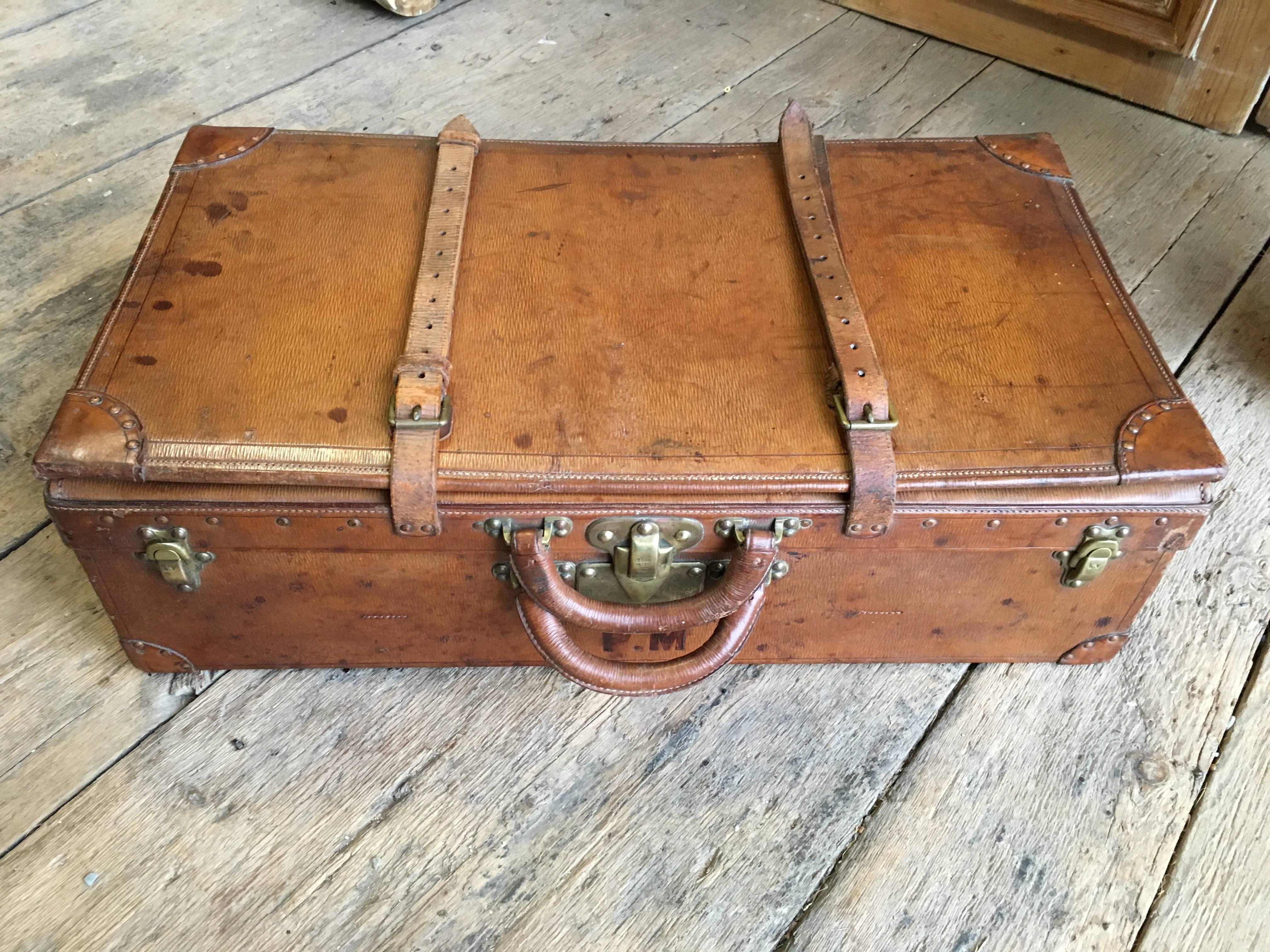 A rare Louis Vuitton "Malle Cabine" expanding suitcase, circa 1910, formerly owned my Pierre Moulin, founder of the Pierre Deux shops, monogrammed with "PM" below the double handles. Great condition with expected wear. The