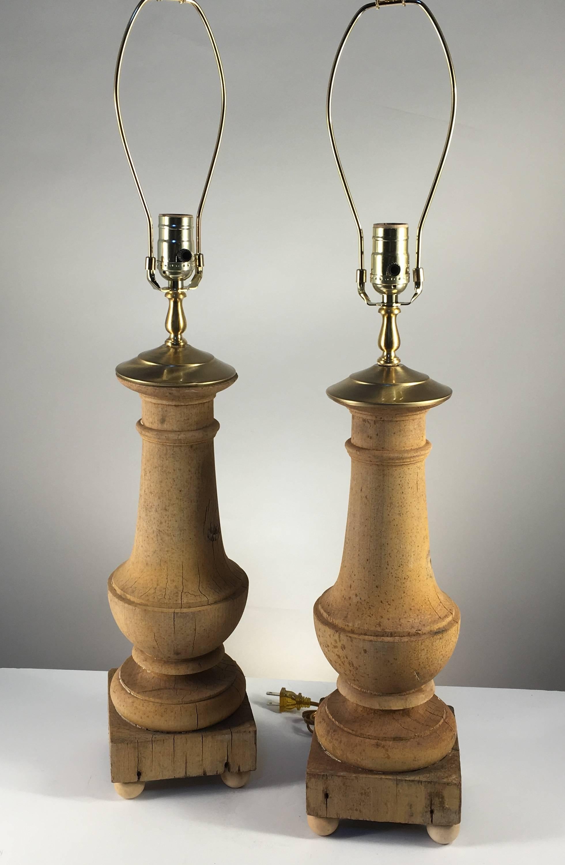 A pair of baluster form lamps in stripped pine, architectural elements, recently wired for electricity with brass vase caps and hardware. A nice size and color.
Measures: 23" H without harp. 30" with harp.