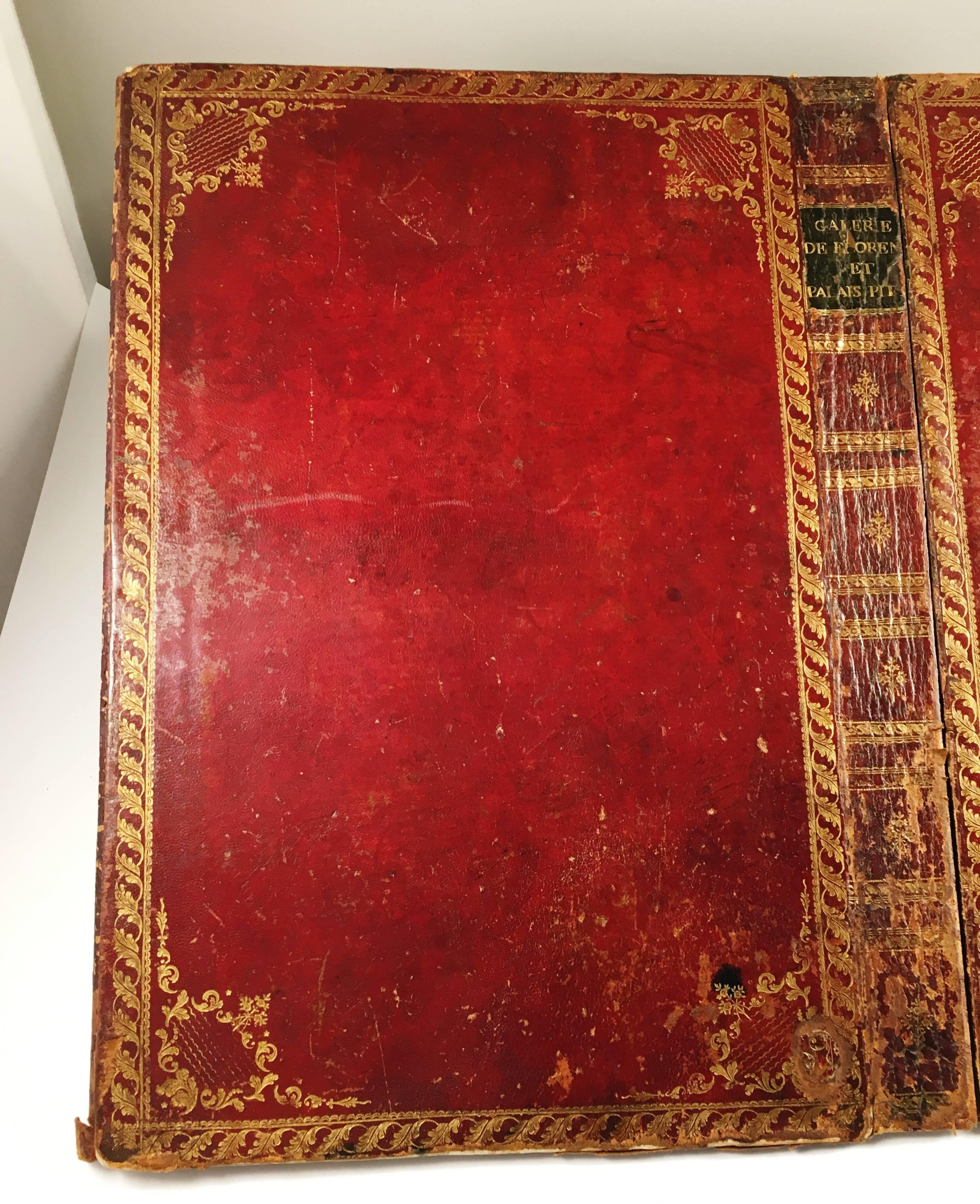 A large size red leather desk blotter from the Louis XV period France, circa 1770, created from the cover of a large Italian folio, the vivid color of the contrasting ox blood red leather and moss green leather on the cover is stunning, with gold