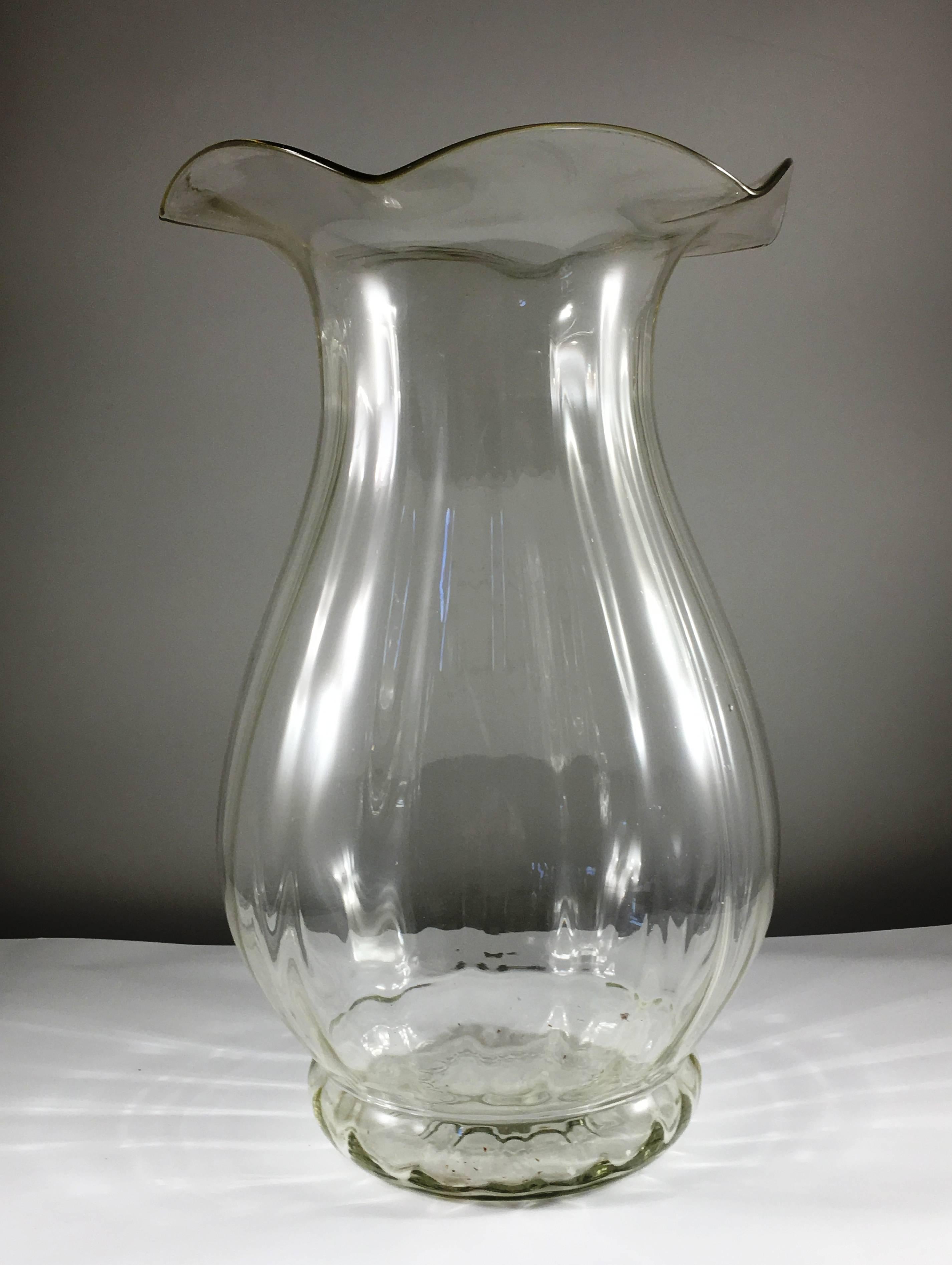 A very large mid-20th century handblown vase in clear glass, circa 1940, American, with petal form top and ribbed body.