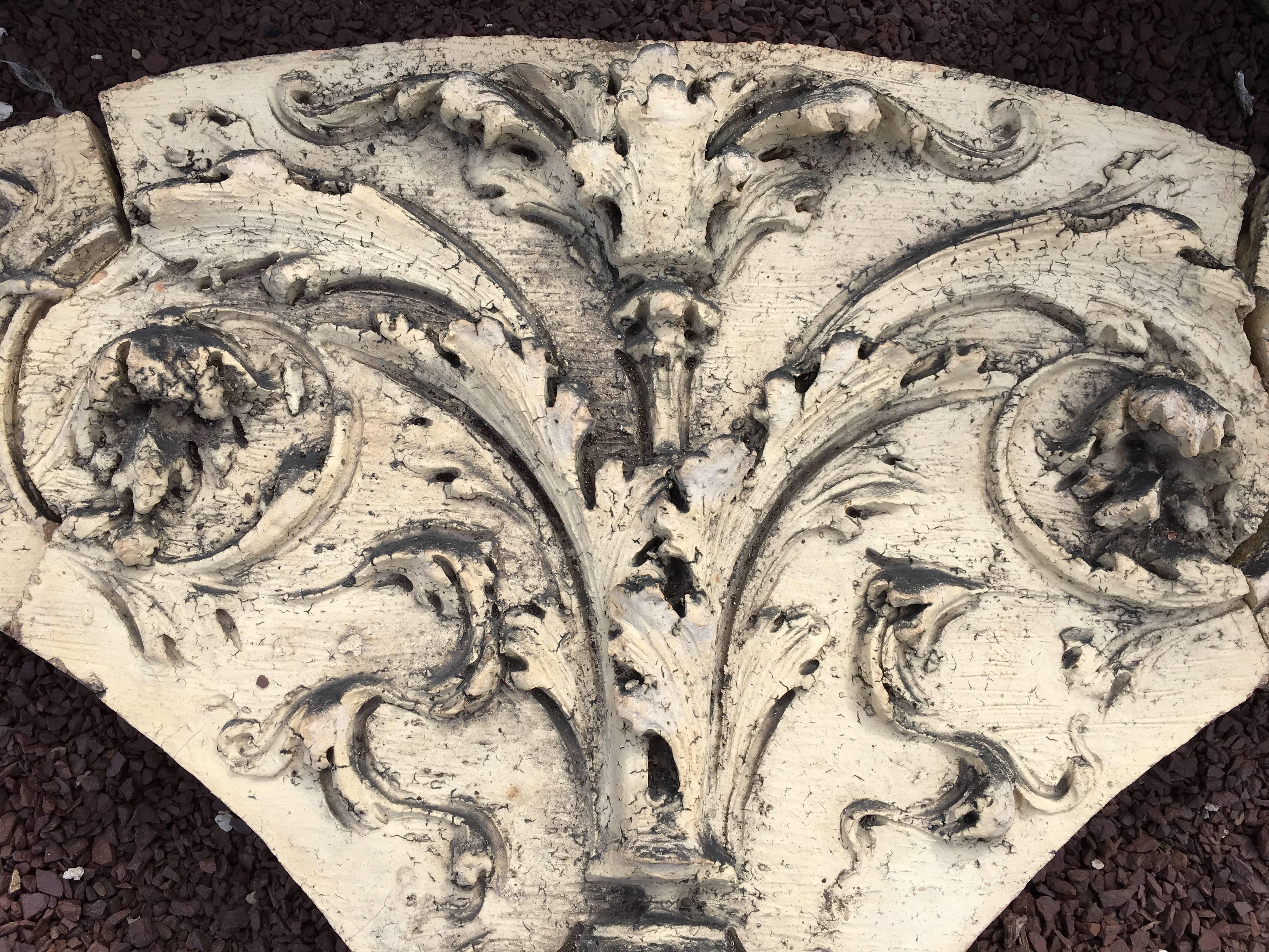 A decorative 19th century terracotta architectural frieze, arch-form in three-parts, with gadroons, acanthus leaves and other molded decoration. From a building in Philadelphia.