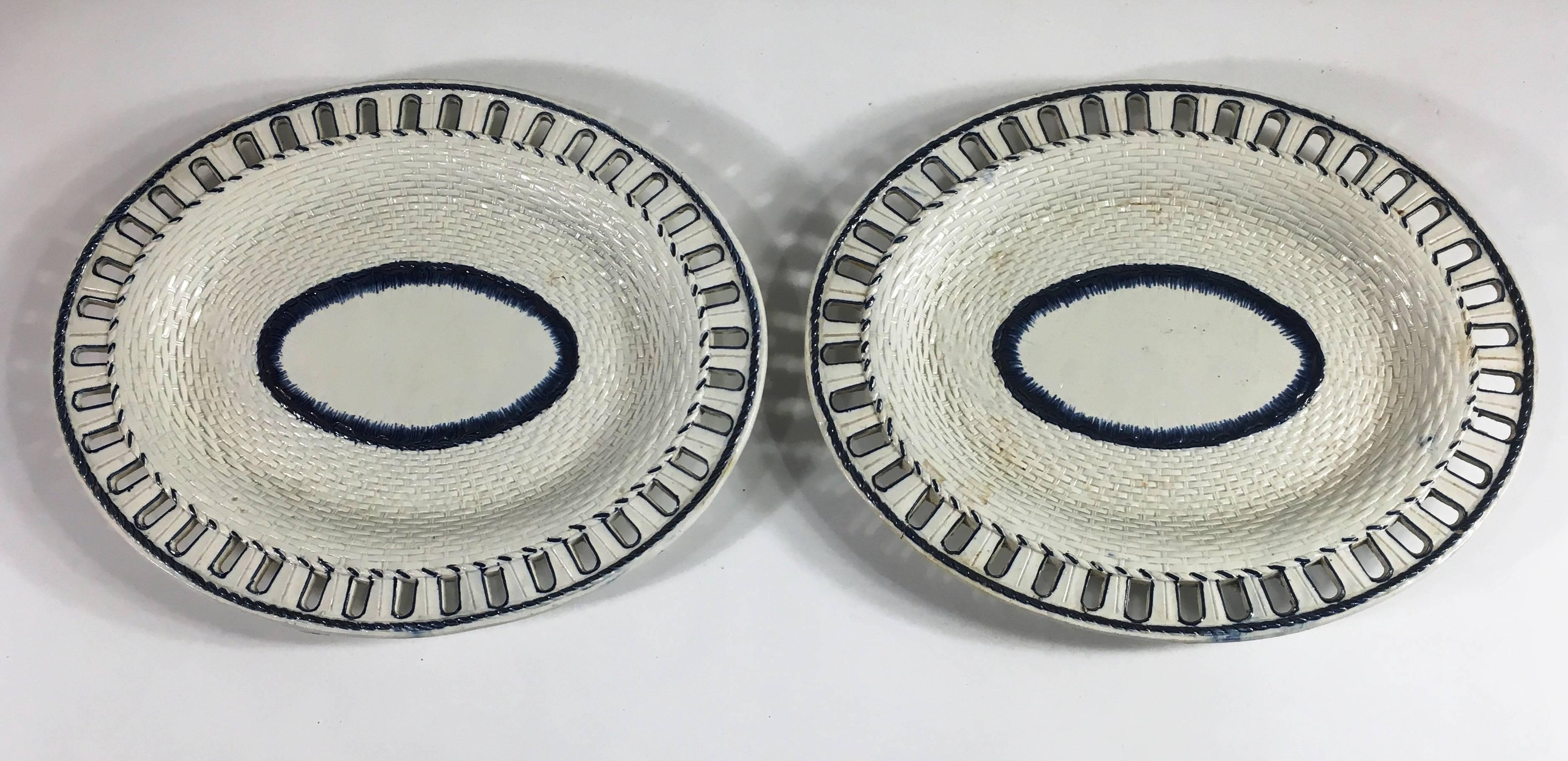 A nice pair of Leeds blue and white feather-ware oval under-plates with a basket weave texture and a reticulated border, circa 1850. Signed 