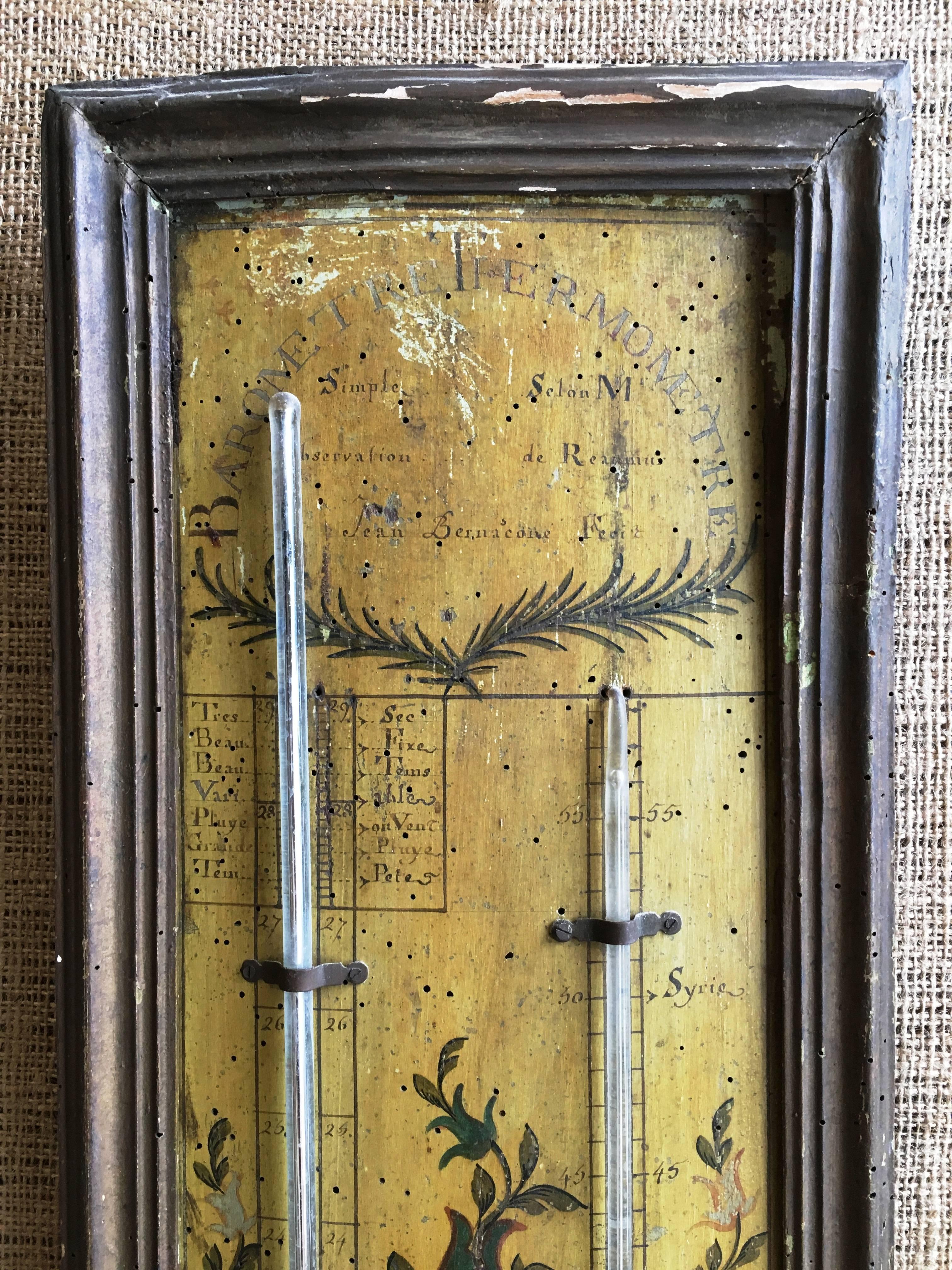 A French provincial barometer/ thermometer on a painted wood panel in a frame, circa 1790, using the Reaumur standard of measurements (Antoine Ferchault de Reaumur). Original paint and measurements.