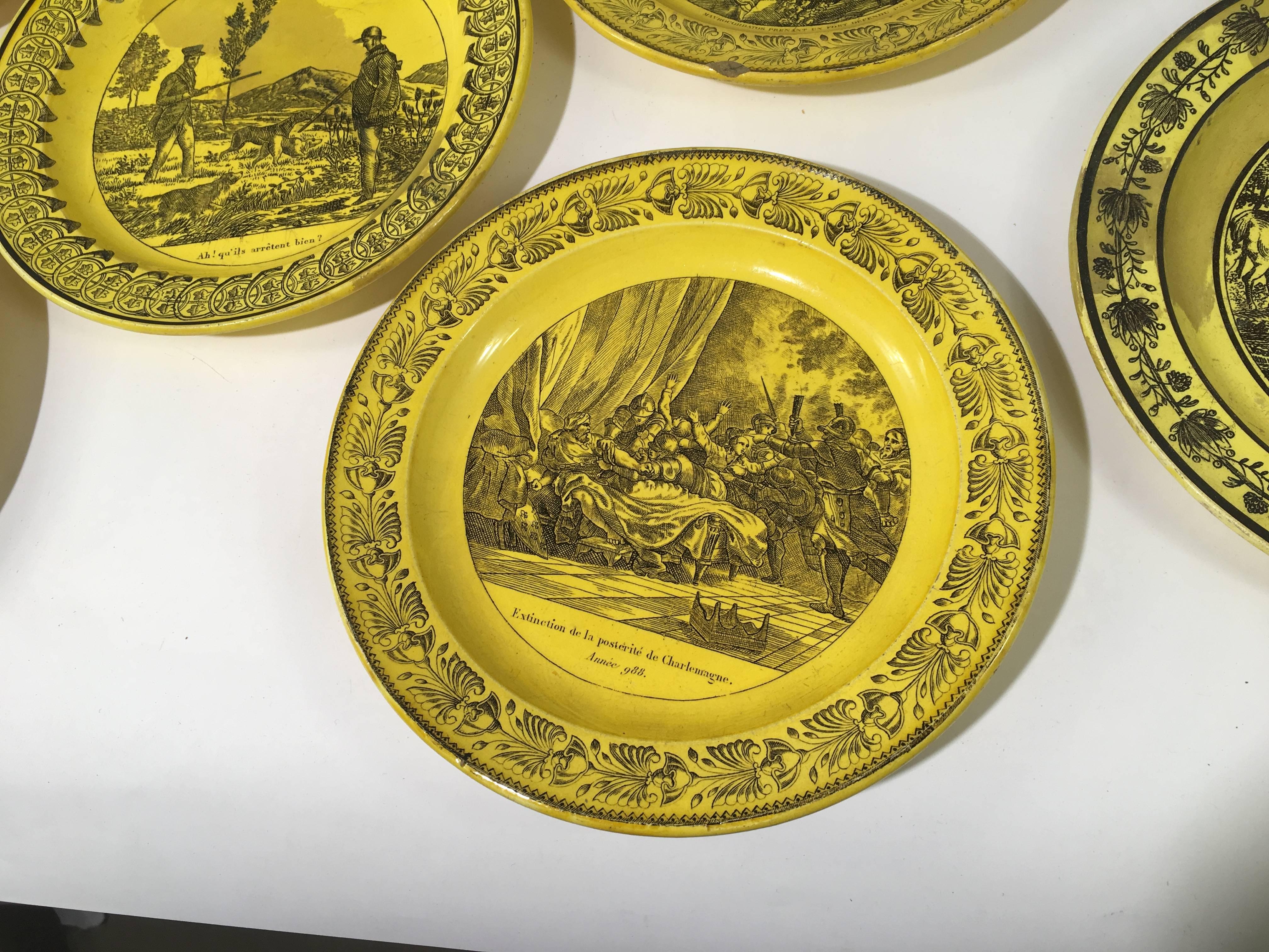A collection of eight assorted ceramic plates in yellow glaze with various military, hunting, etc. scenes on each, from Creil et Montereau, circa 1810, France.