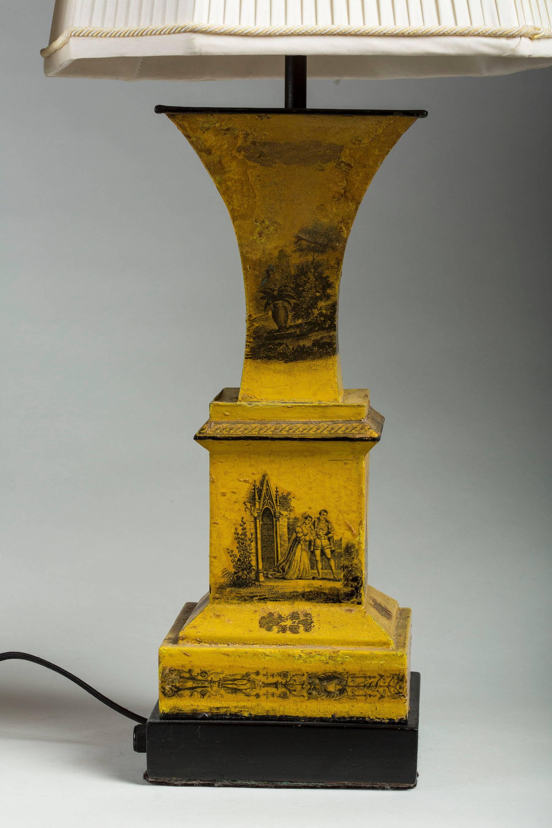 Each mounted as a lamp, the flaring top above a stepped square base, with a decor of antique scenes and symbols. Electrified. Measures: Height of urns only, 15in.; height overall, 29.5in.
  